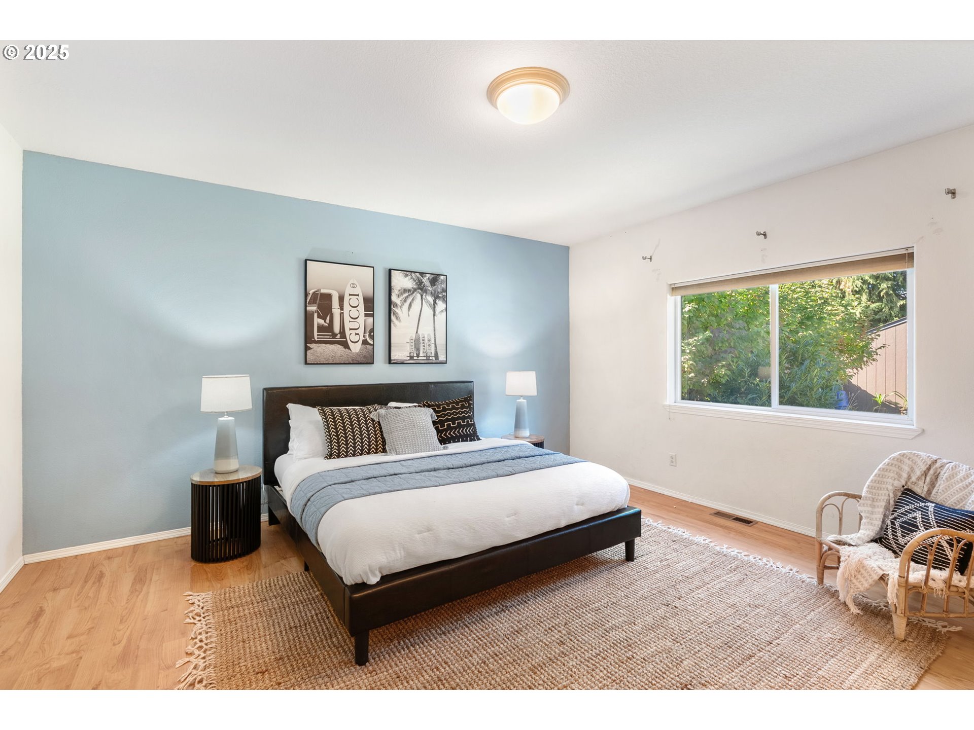 780 Henderson Road Hood River, OR 97031 - Photo 13 of 35 a bedroom with a bed a couch and a large window