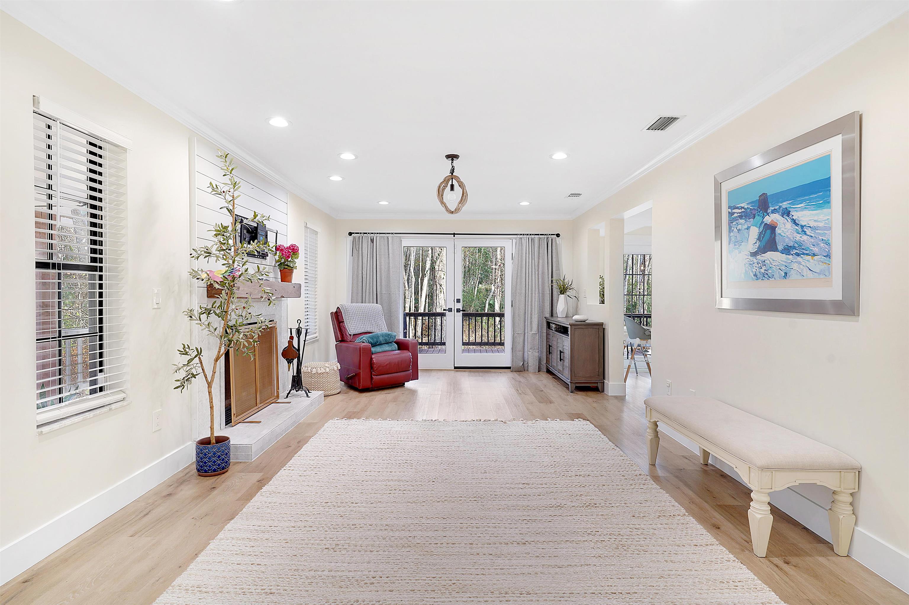 3020 Mac Road St. Augustine, FL 32086 - Photo 11 of 49 Living area with french doors, ornamental molding, light wood-type flooring, and recessed lighting