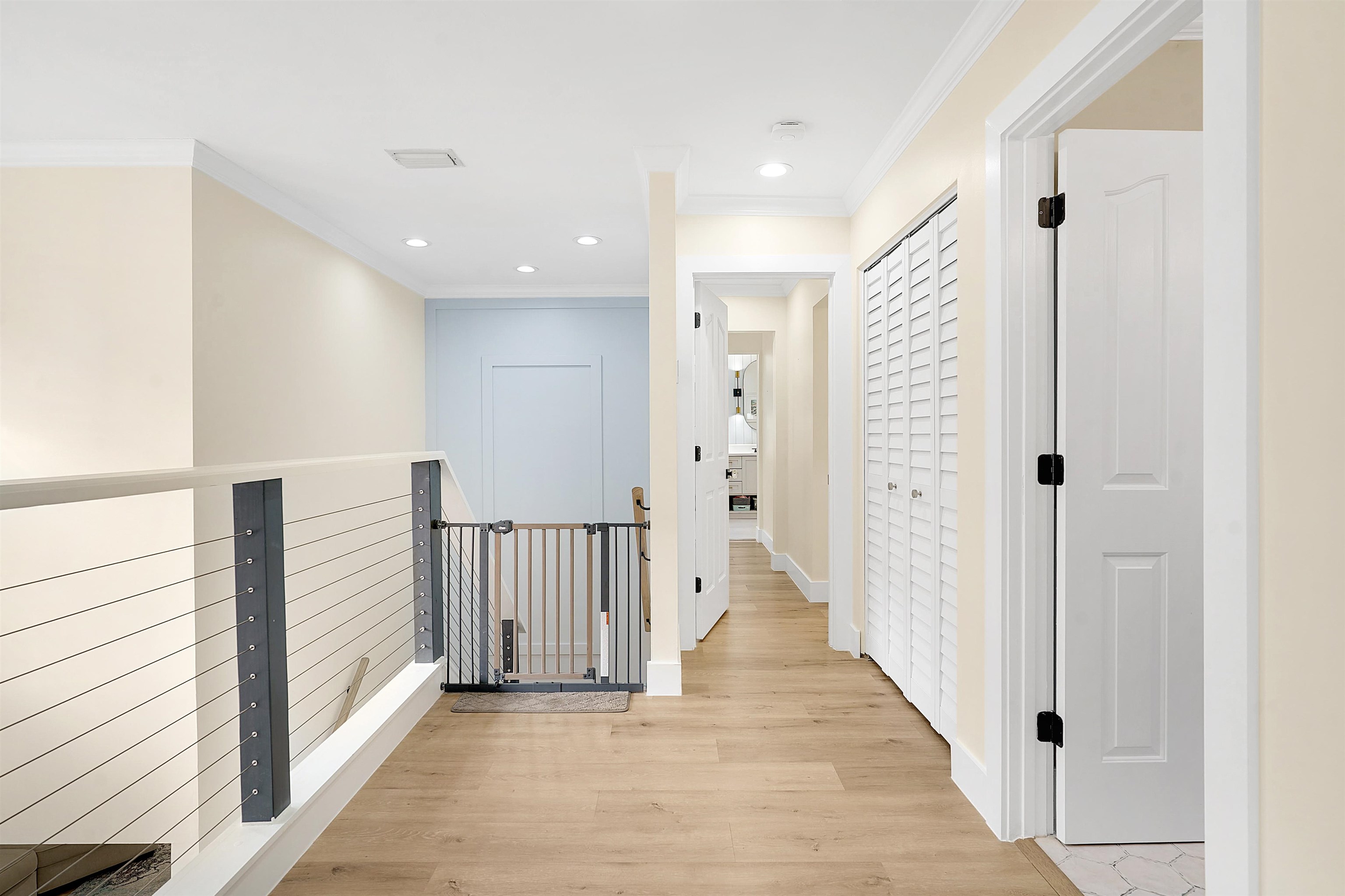 3020 Mac Road St. Augustine, FL 32086 - Photo 18 of 49 Hall featuring light wood-style flooring, crown molding, and recessed lighting