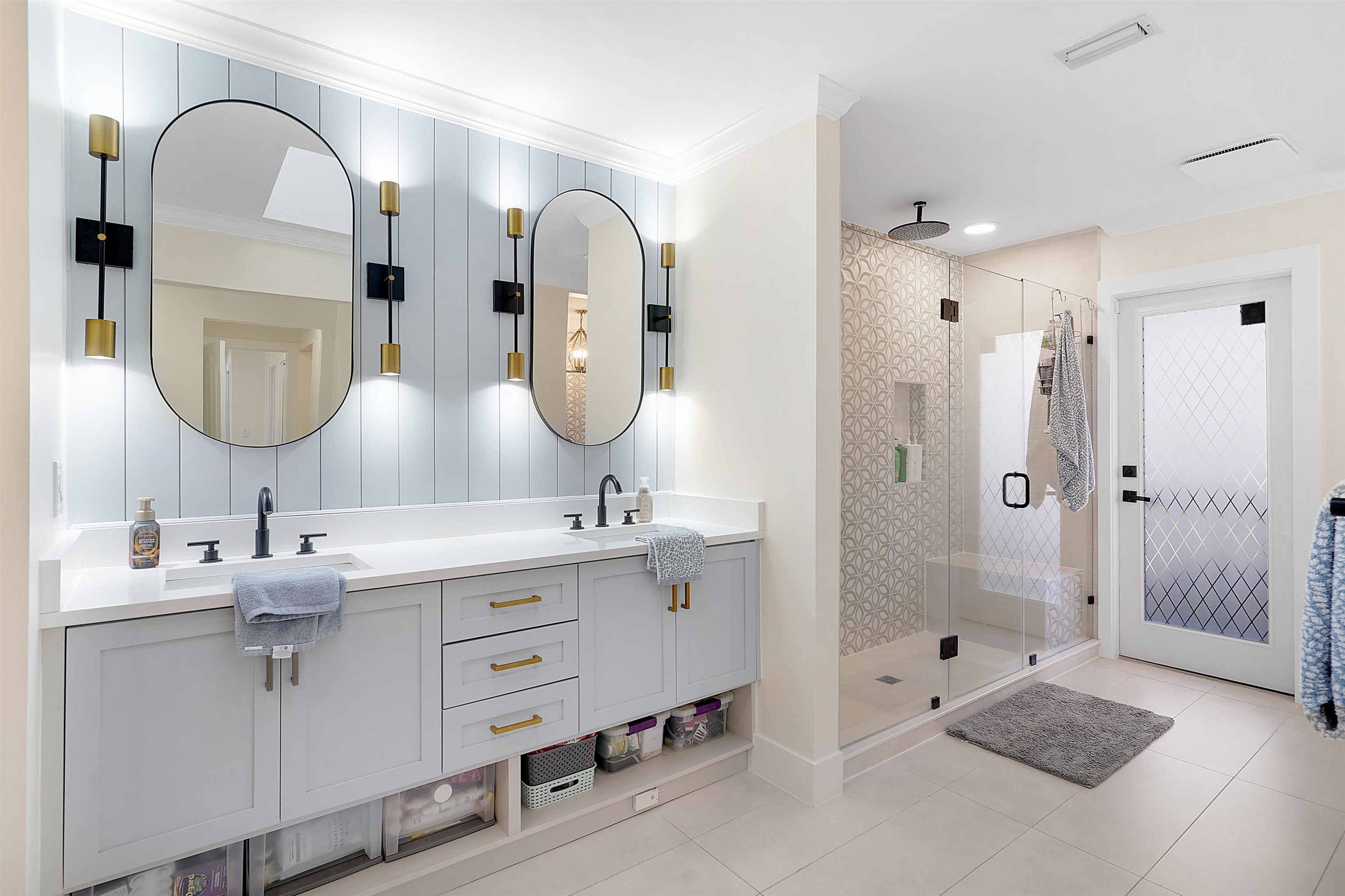 3020 Mac Road St. Augustine, FL 32086 - Photo 21 of 49 Full bath with ornamental molding, double vanity, a shower stall, and light tile patterned flooring