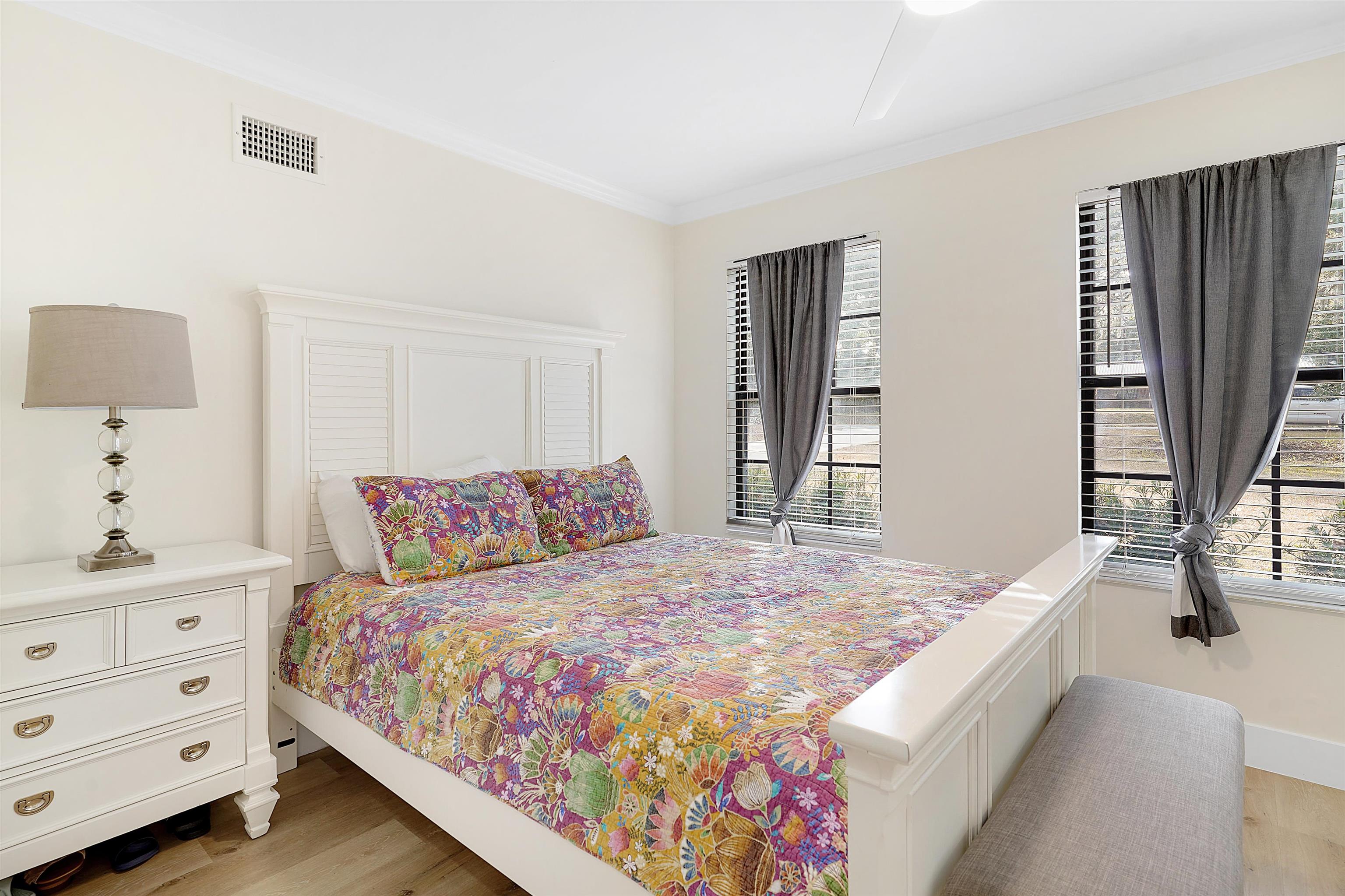 3020 Mac Road St. Augustine, FL 32086 - Photo 26 of 49 Bedroom featuring ornamental molding and light wood finished floors