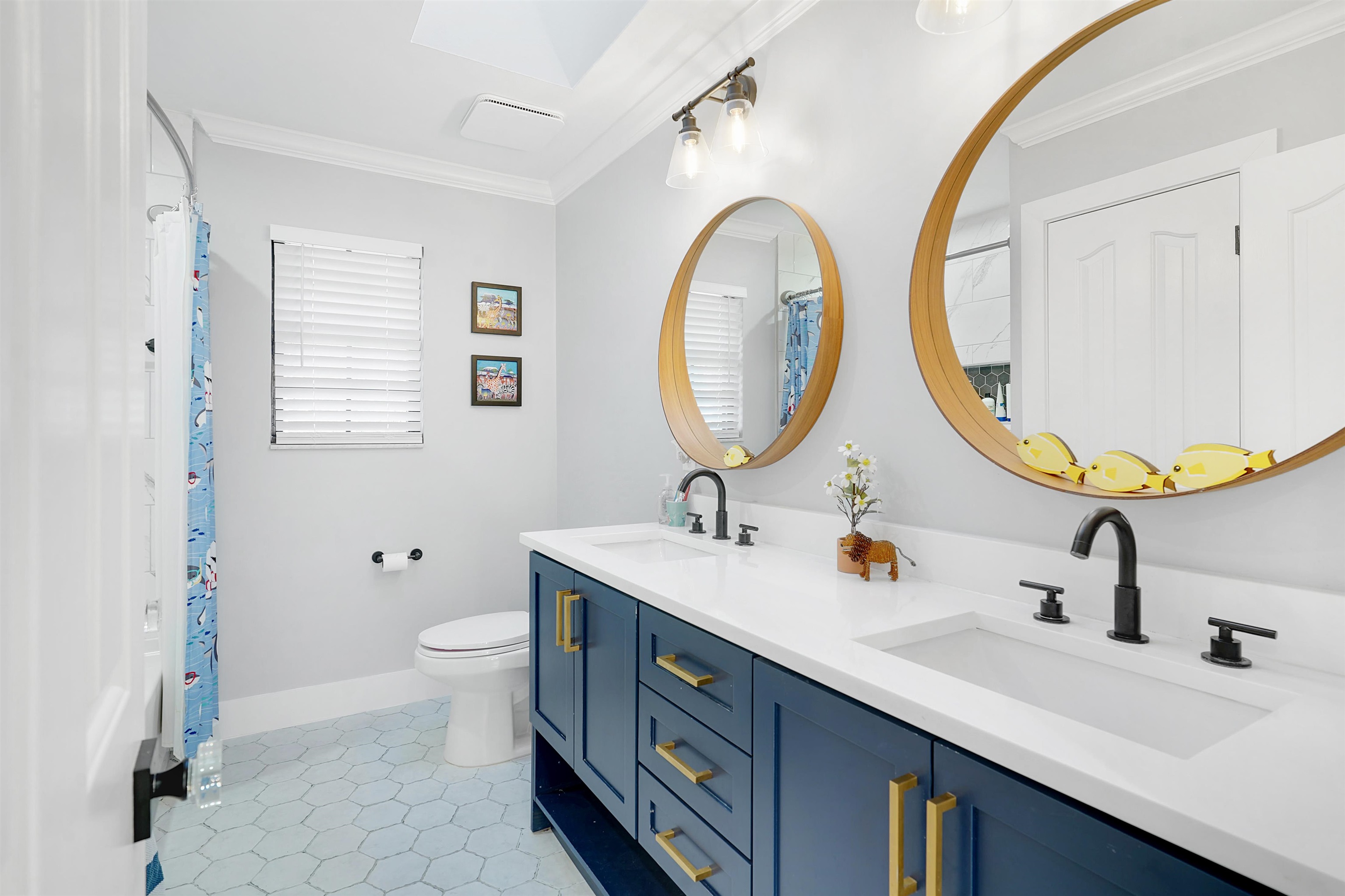 3020 Mac Road St. Augustine, FL 32086 - Photo 31 of 49 Bathroom featuring double vanity, crown molding, light tile patterned floors, and a shower with curtain