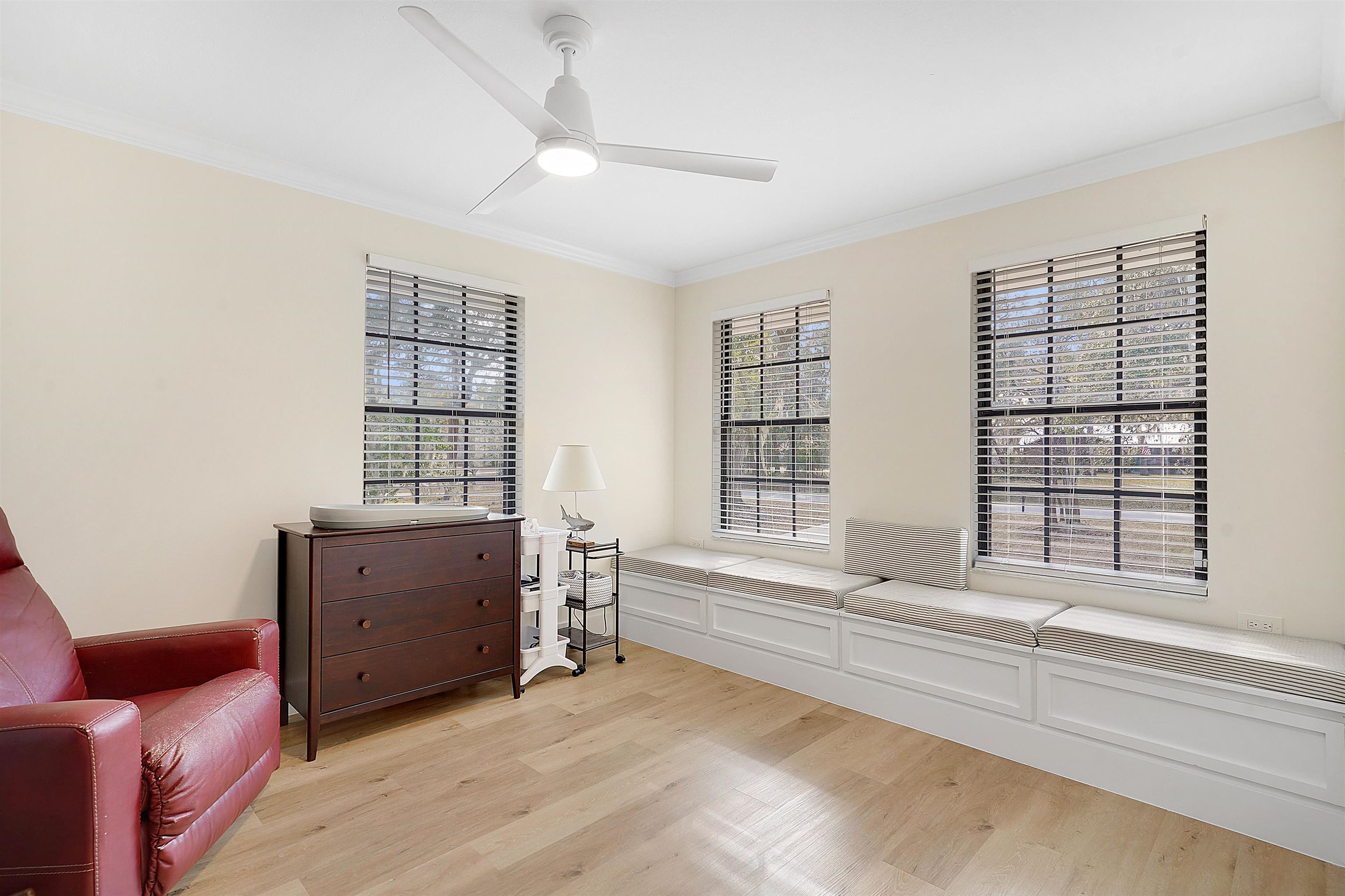 3020 Mac Road St. Augustine, FL 32086 - Photo 32 of 49 Living area featuring crown molding, light wood-style floors, and ceiling fan
