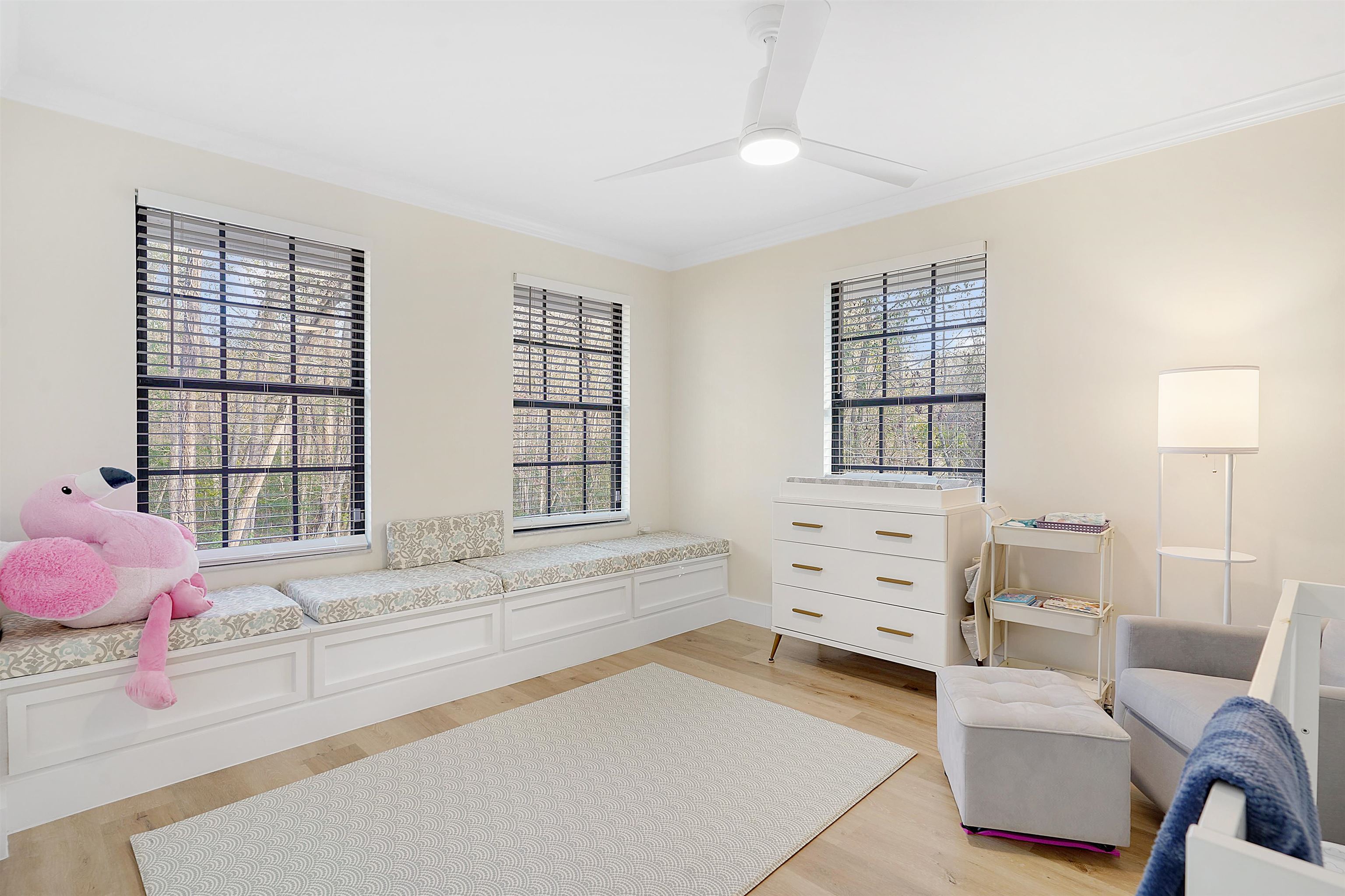 3020 Mac Road St. Augustine, FL 32086 - Photo 34 of 49 Sitting room with light wood-type flooring, crown molding, and ceiling fan
