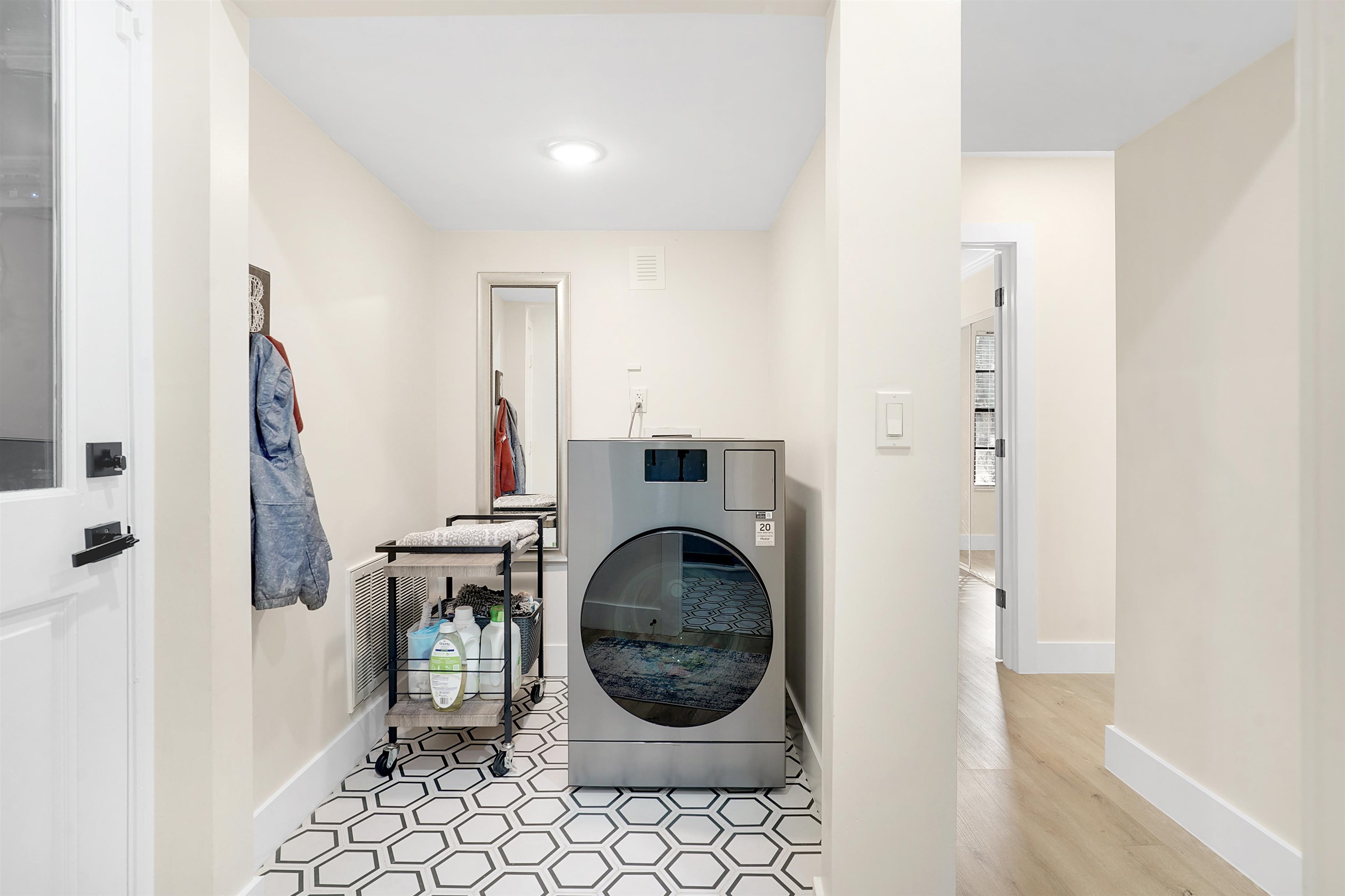 3020 Mac Road St. Augustine, FL 32086 - Photo 35 of 49 Laundry area with washer / clothes dryer and light tile patterned floors