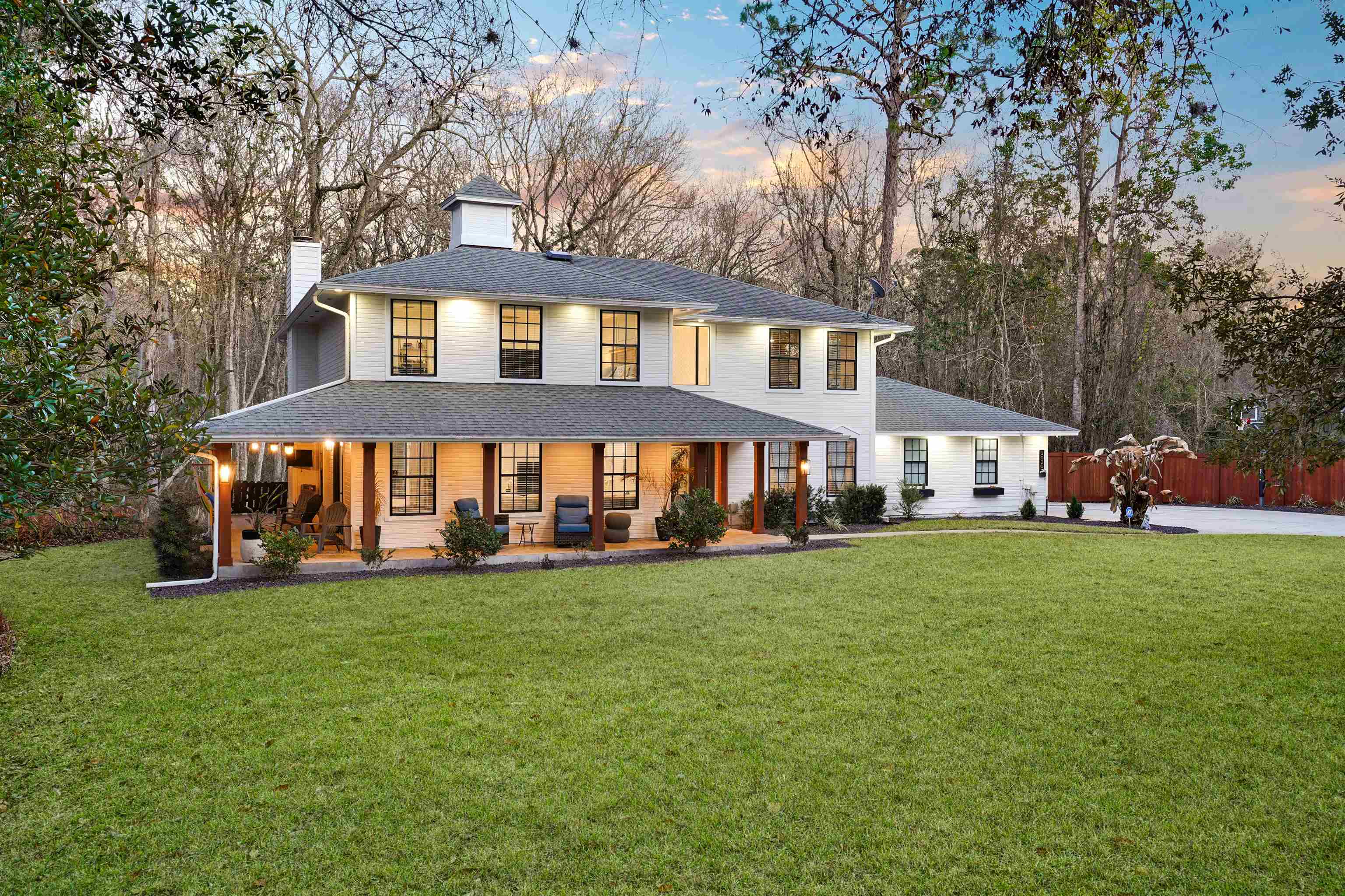 3020 Mac Road St. Augustine, FL 32086 - Photo 43 of 49 View of front of property featuring a porch, a chimney, and view of scattered trees