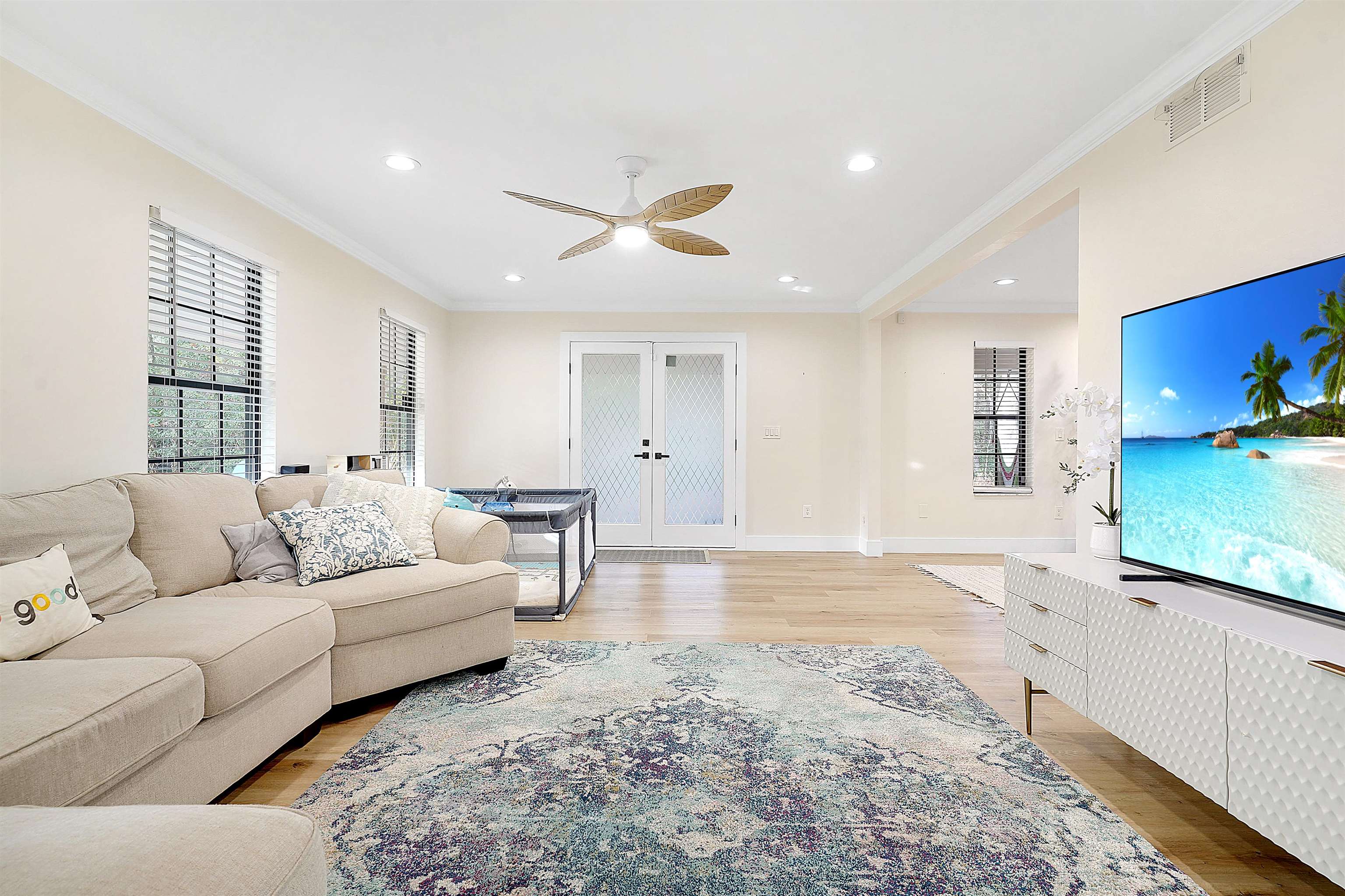 3020 Mac Road St. Augustine, FL 32086 - Photo 9 of 49 Living area featuring french doors, light wood-type flooring, a ceiling fan, ornamental molding, and recessed lighting
