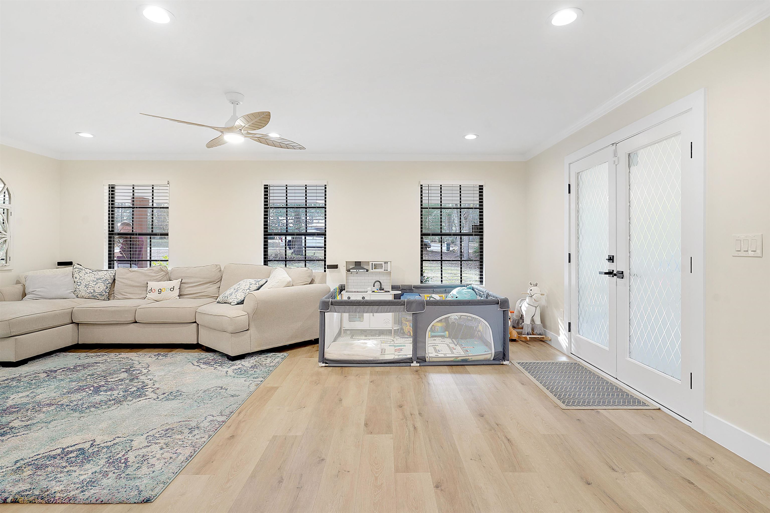 3020 Mac Road St. Augustine, FL 32086 - Photo 10 of 49 Living area with wood finished floors, french doors, ceiling fan, recessed lighting, and ornamental molding