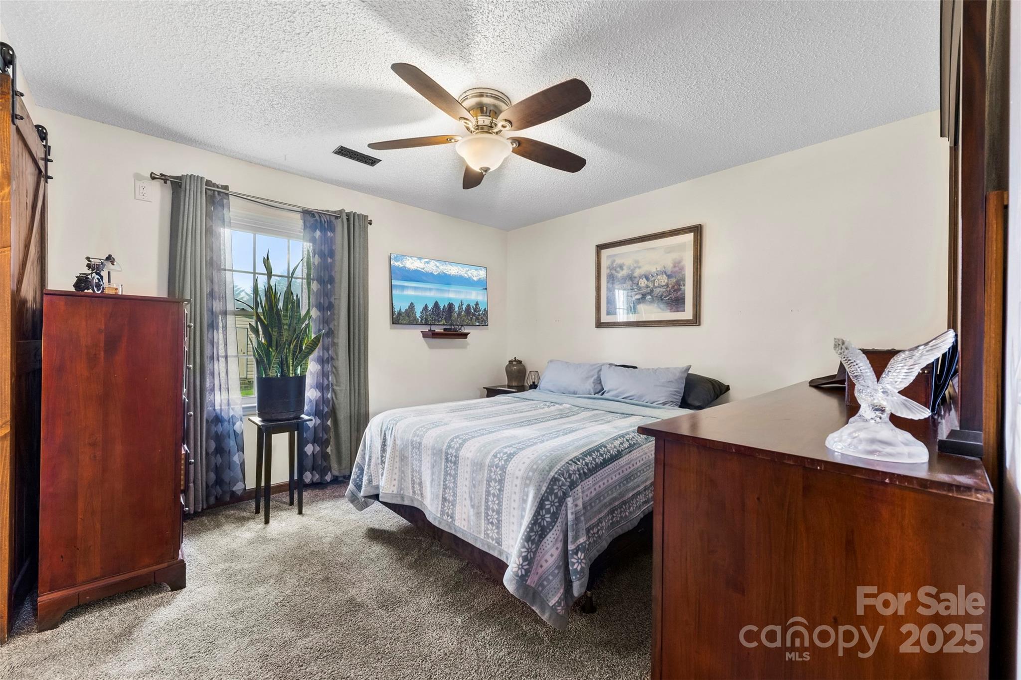 111 Hicks Road, Unit 9 Grover, NC 28073 - Photo 19 of 29 a bedroom with a bed and window