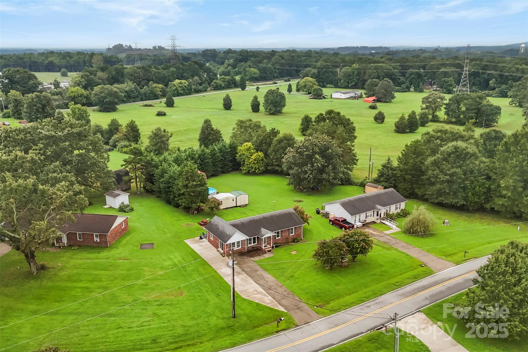 111 Hicks Road, Unit 9 Grover, NC 28073 - Photo 27 of 29 an aerial view of green landscape with trees houses and mountain view