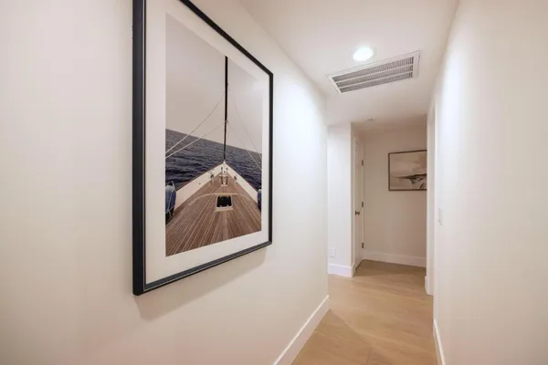 a bedroom with furniture and a rug