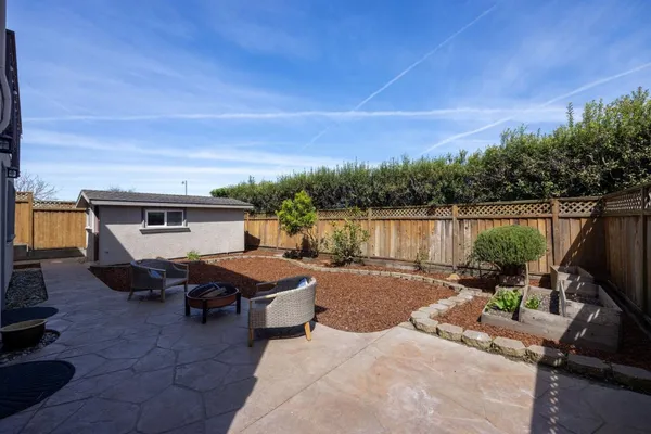an aerial view of a house with a swimming pool