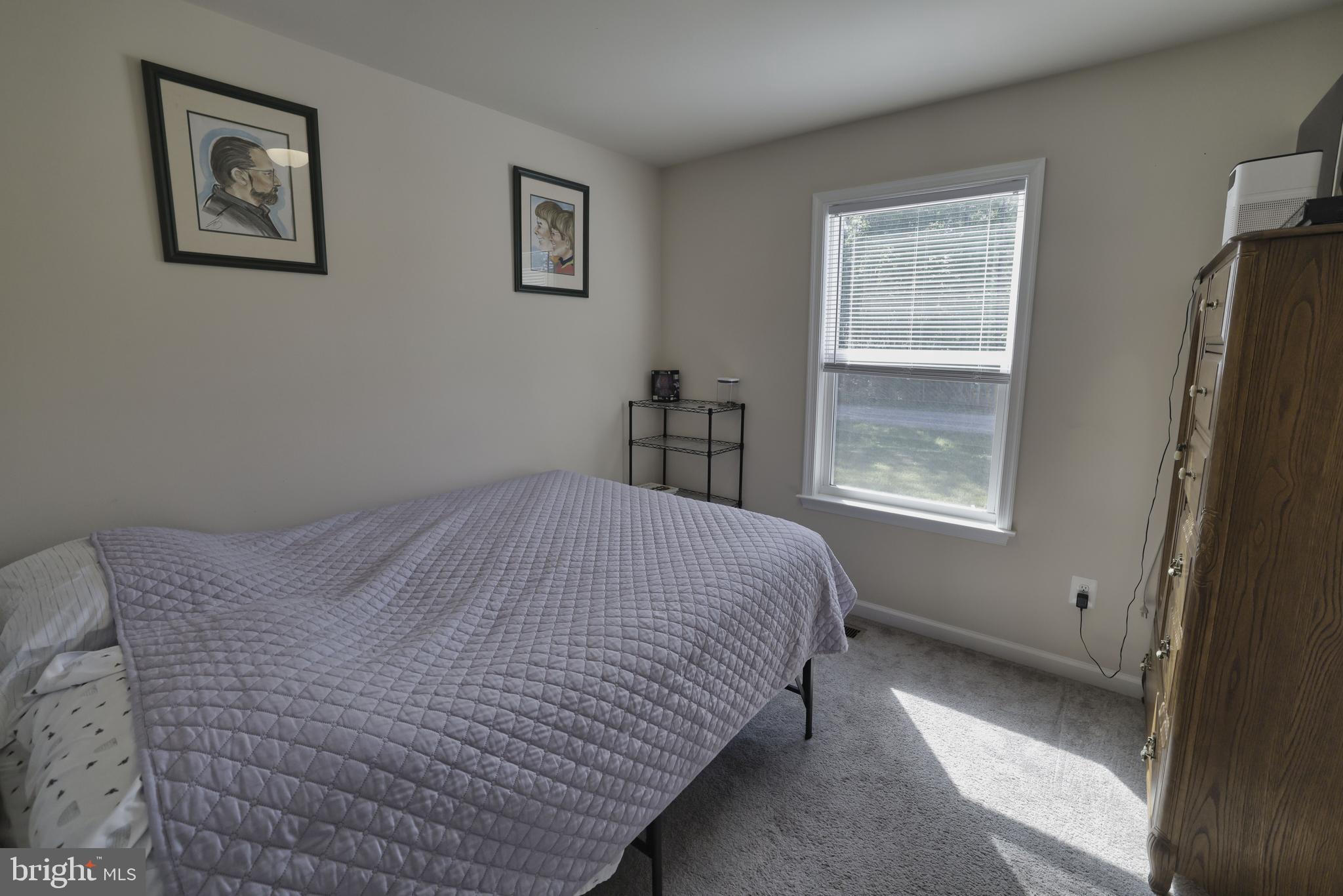 48 Rustic Lane Colonial Beach, VA 22443 - Photo 37 of 47 a bed sitting in a bedroom next to a window