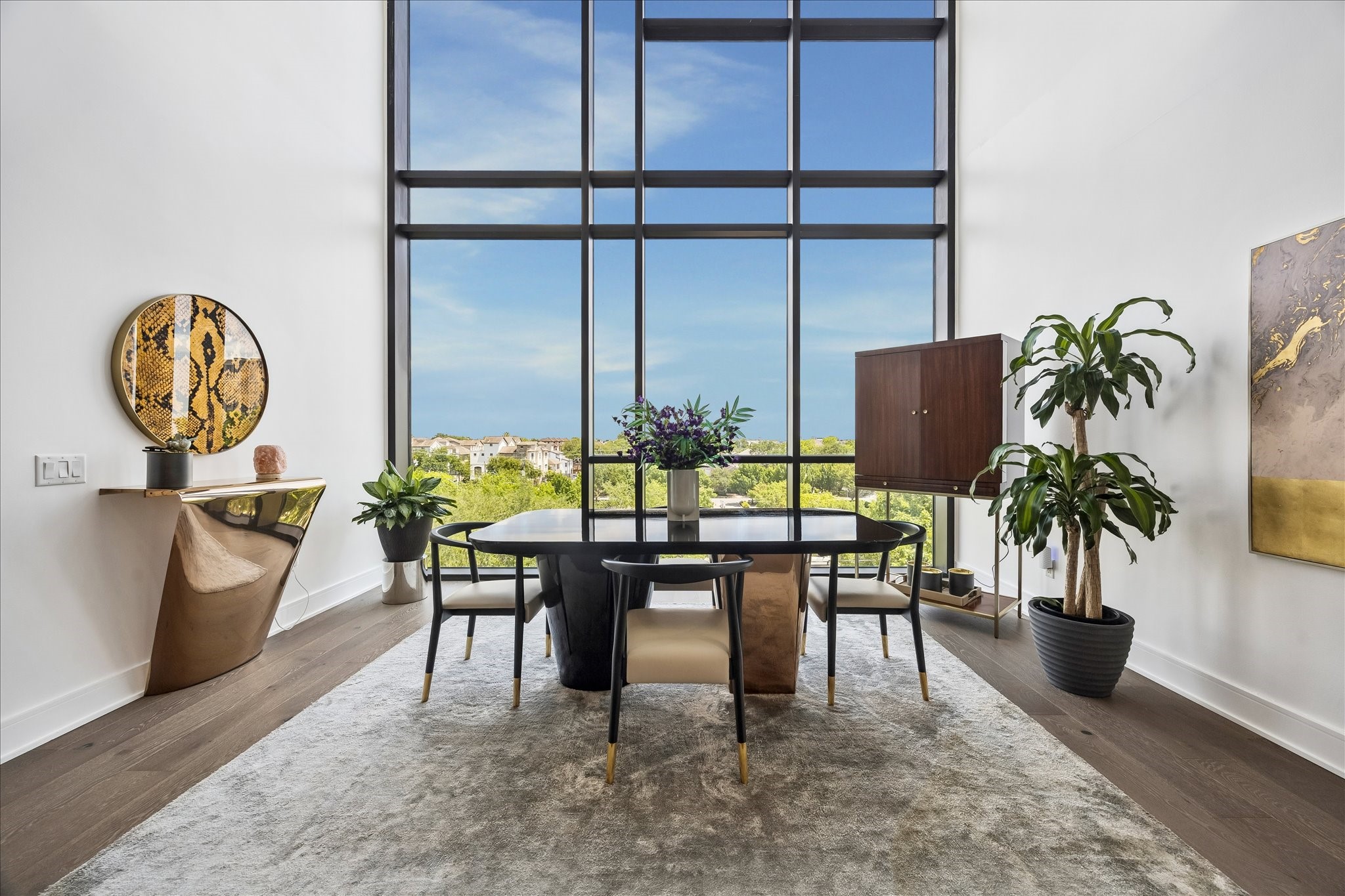 5104 Caroline Street, Unit 403 Houston, TX 77004 - Photo 4 of 33 24' floor to ceiling windows in dining area with automatic light filtering shades