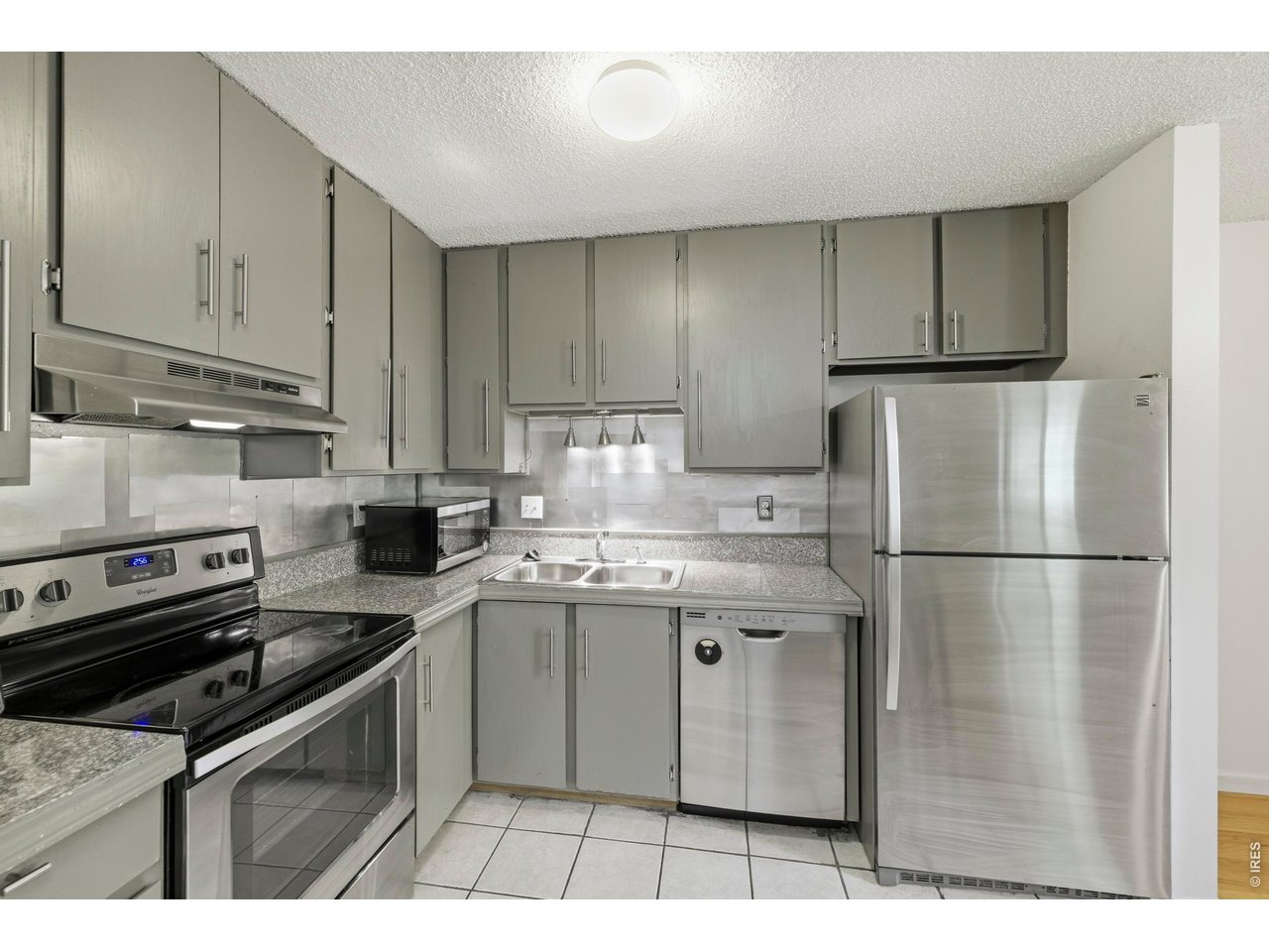 925 Columbia Road, Unit 824 Fort Collins, CO 80525 - Photo 10 of 36 a kitchen with a sink appliances and cabinets