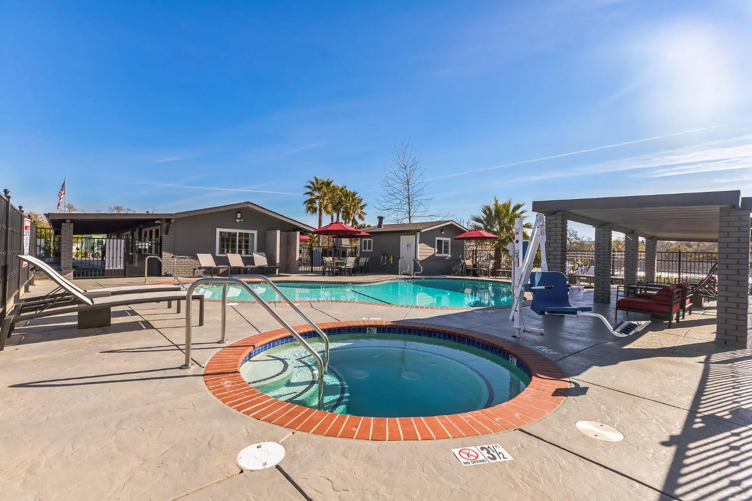 4800 Auburn Folsom Road, Unit 29 Loomis, CA 95650 - Photo 13 of 19 a view of a house with swimming pool and sitting area