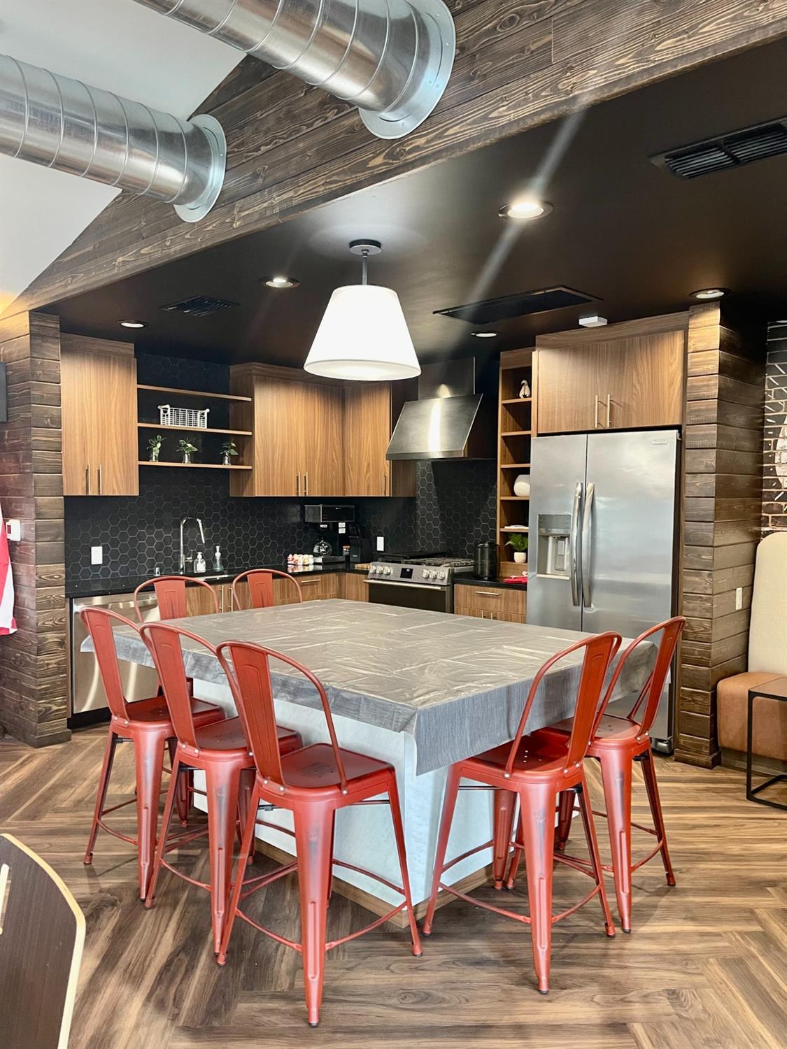 4800 Auburn Folsom Road, Unit 29 Loomis, CA 95650 - Photo 15 of 19 a kitchen with stainless steel appliances granite countertop a table chairs sink and cabinets