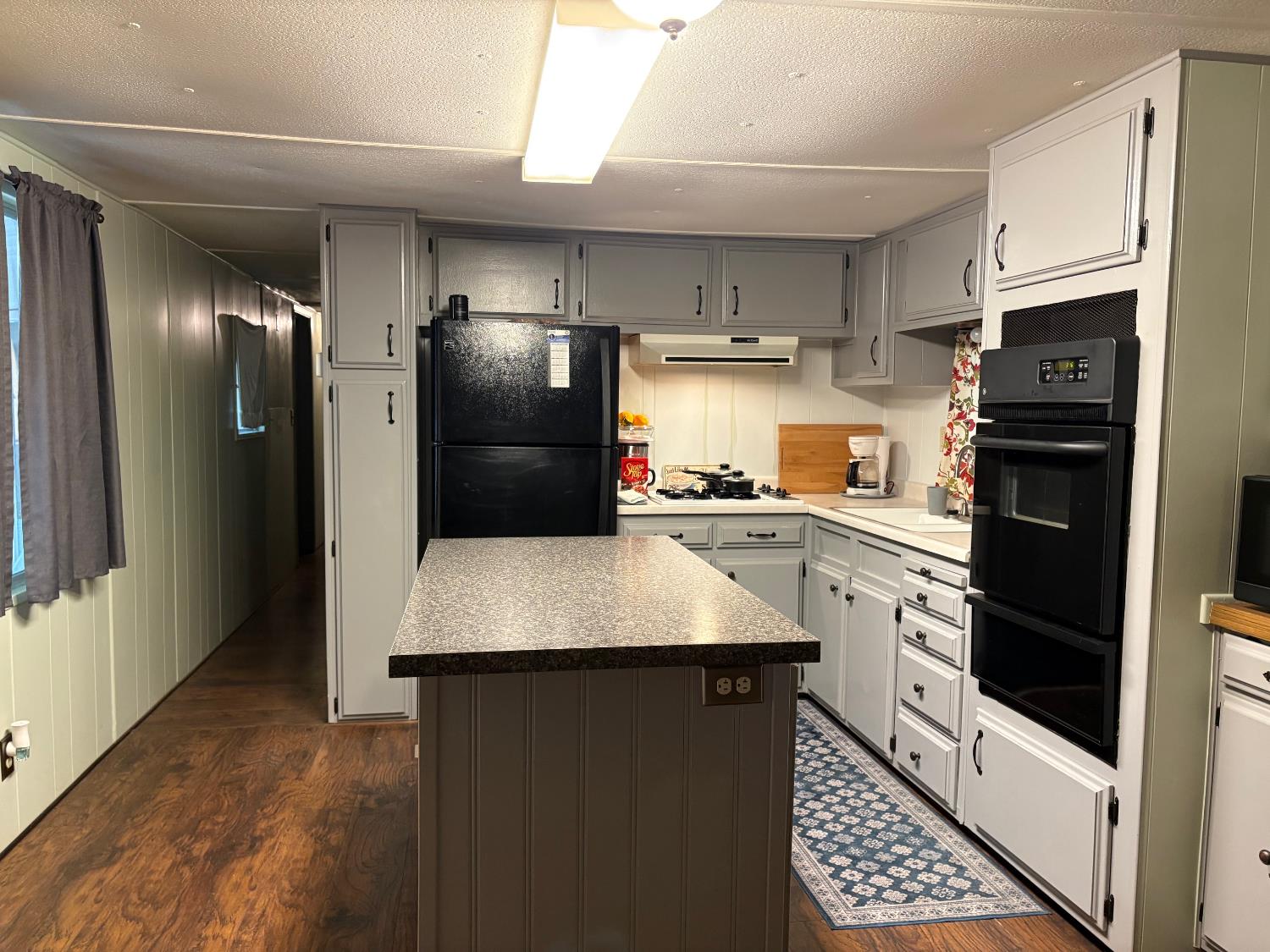 4800 Auburn Folsom Road, Unit 29 Loomis, CA 95650 - Photo 2 of 19 a kitchen with stainless steel appliances a refrigerator sink and stove