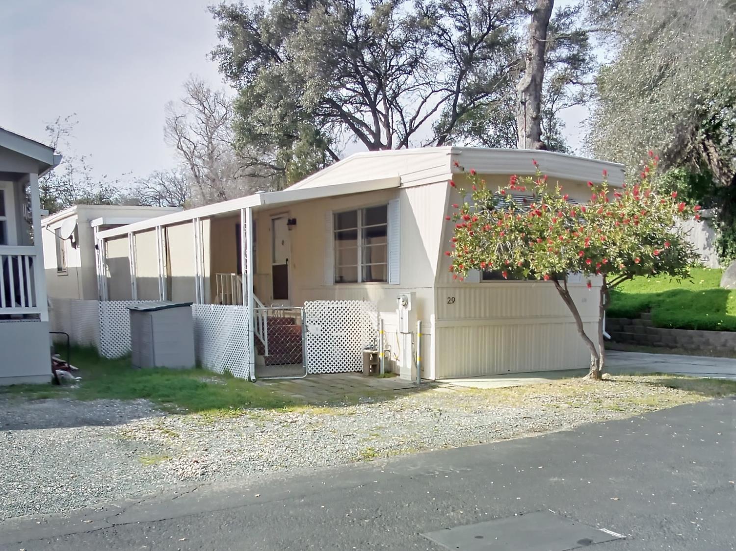 4800 Auburn Folsom Road, Unit 29 Loomis, CA 95650 - Photo 4 of 19 a front view of a house with garden
