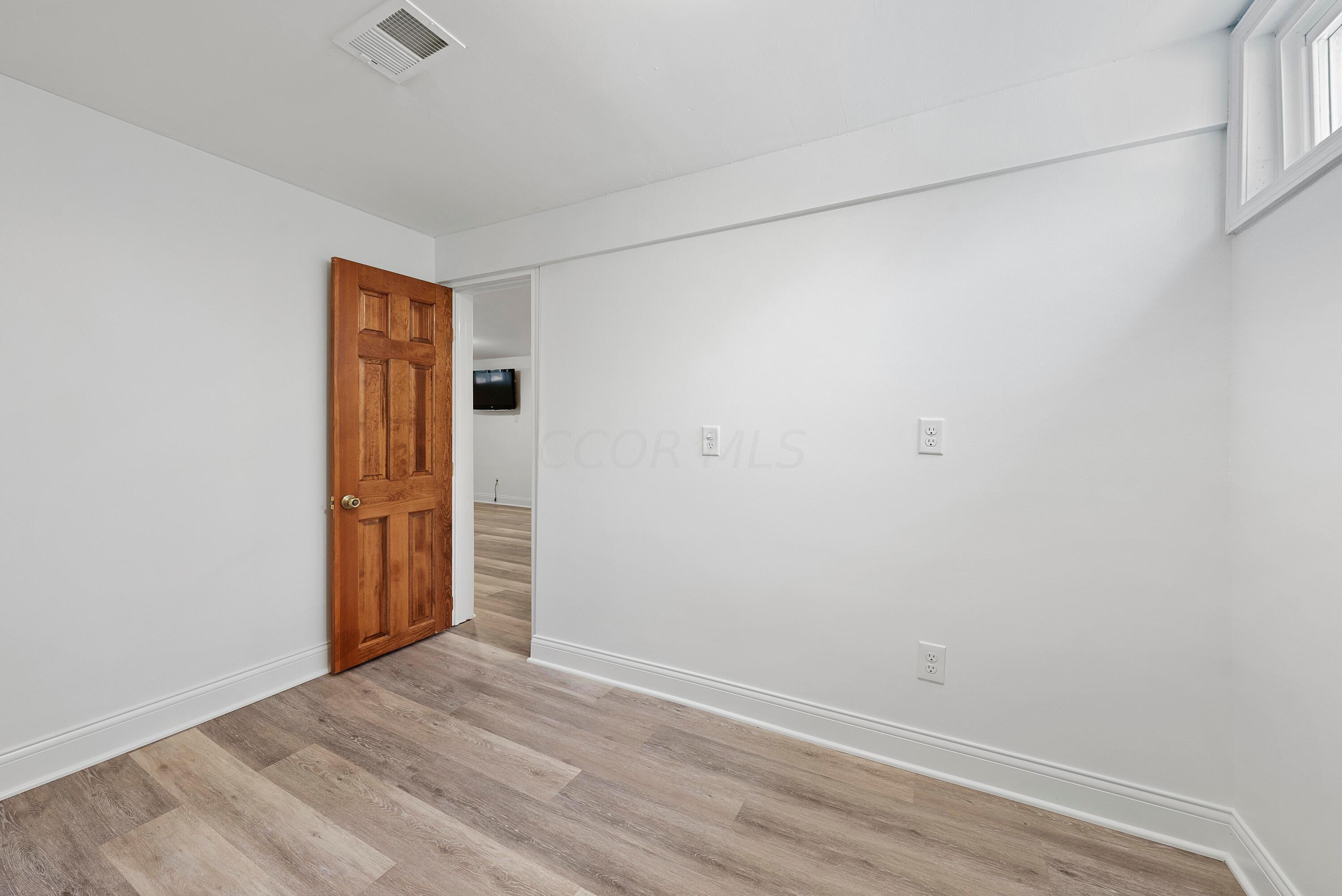 2483 Fishinger Road Columbus, OH 43221 - Photo 30 of 38 Downstairs Bedroom