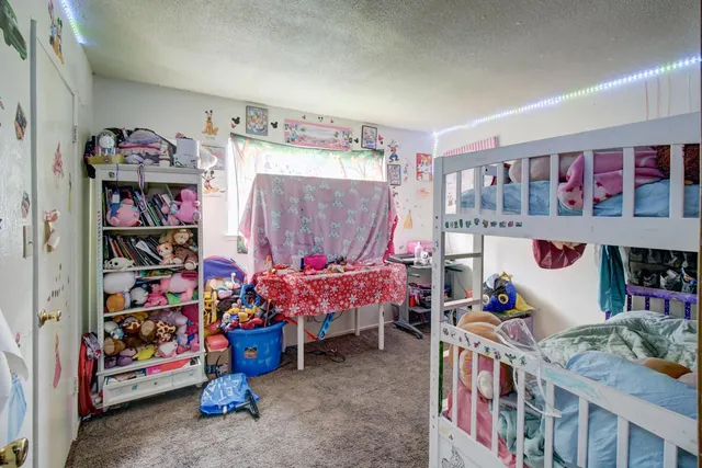 a bedroom with lots of baby toys