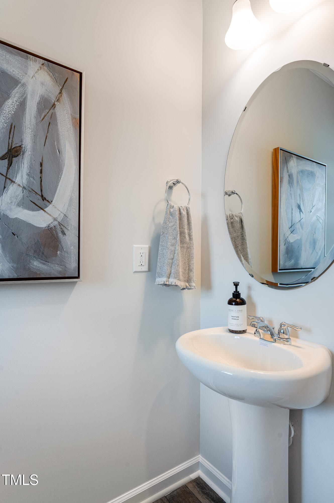 2217 Titanium Rock Road Durham, NC 27704 - Photo 17 of 27 a bathroom with a sink and mirror