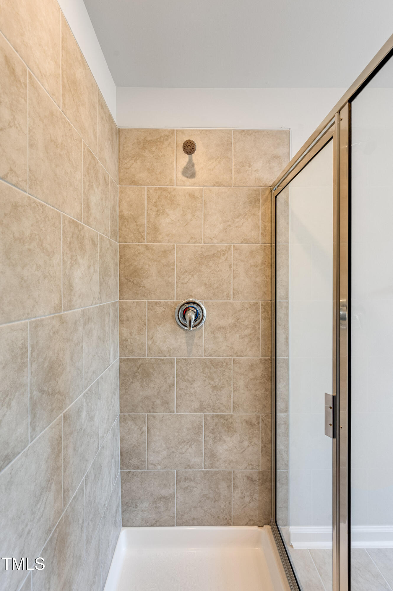 2217 Titanium Rock Road Durham, NC 27704 - Photo 22 of 27 a bathroom with a shower