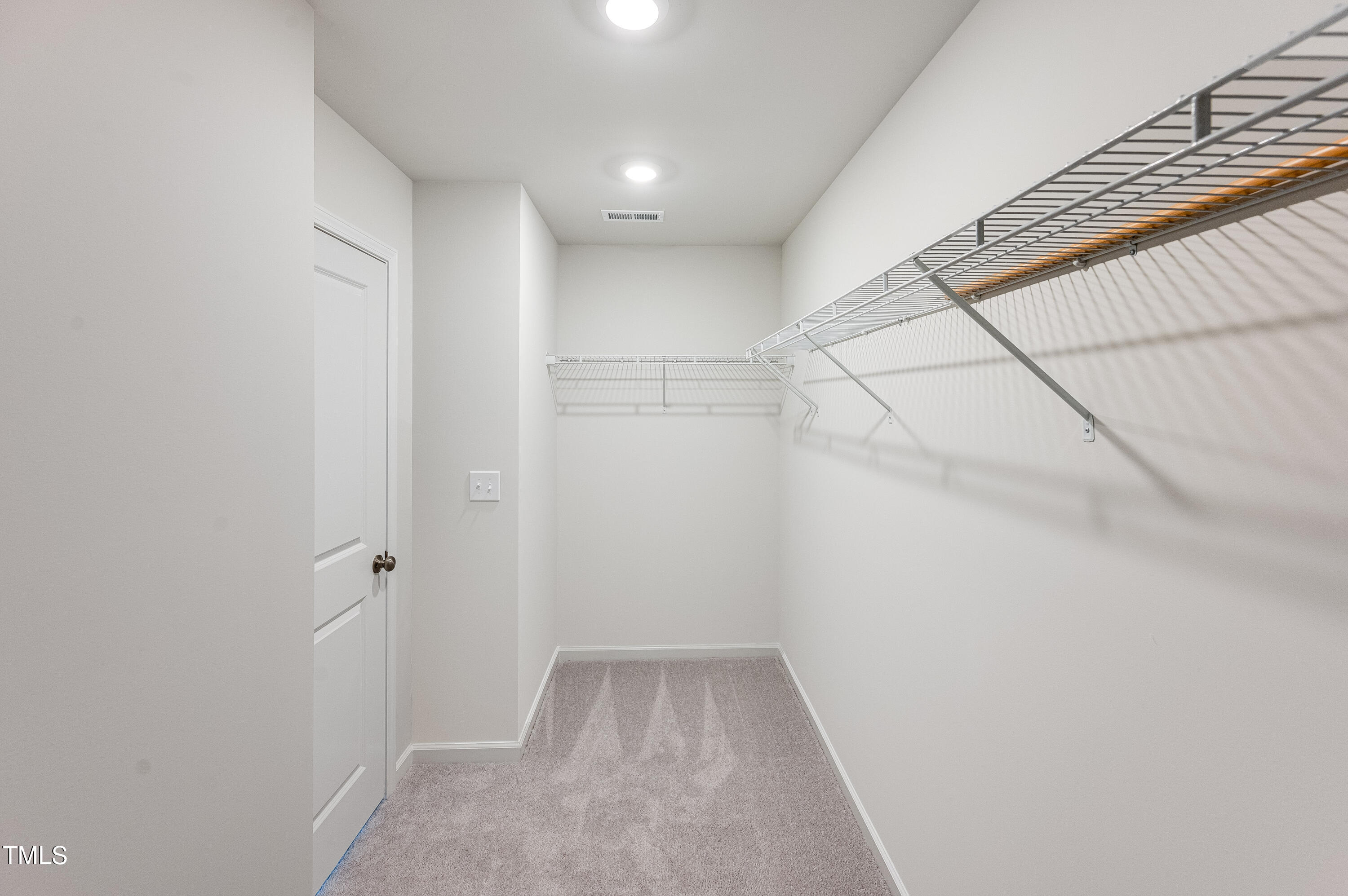 2217 Titanium Rock Road Durham, NC 27704 - Photo 24 of 27 a view of a room with racks on the wall