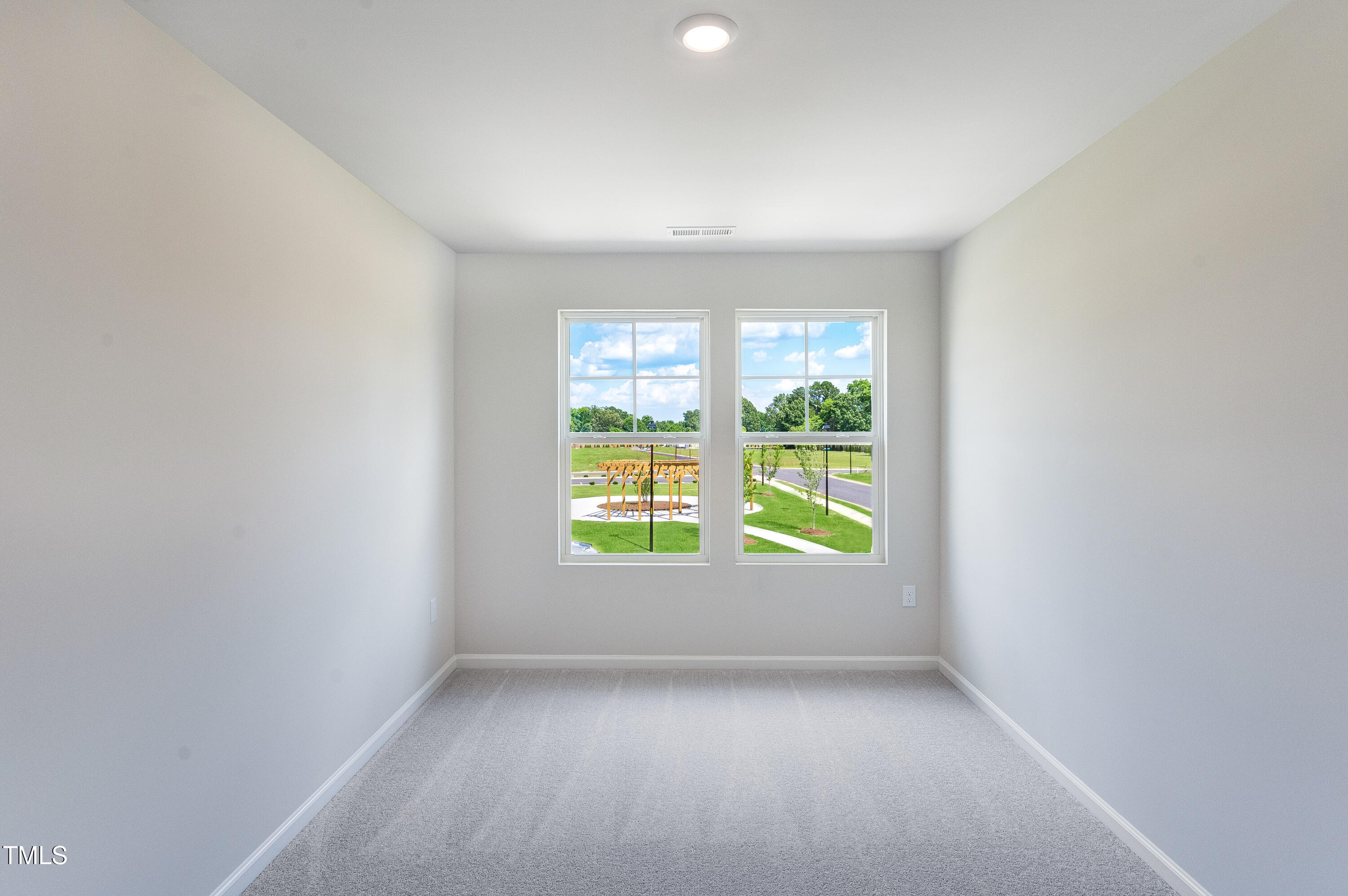 2217 Titanium Rock Road Durham, NC 27704 - Photo 25 of 27 an empty room with a window