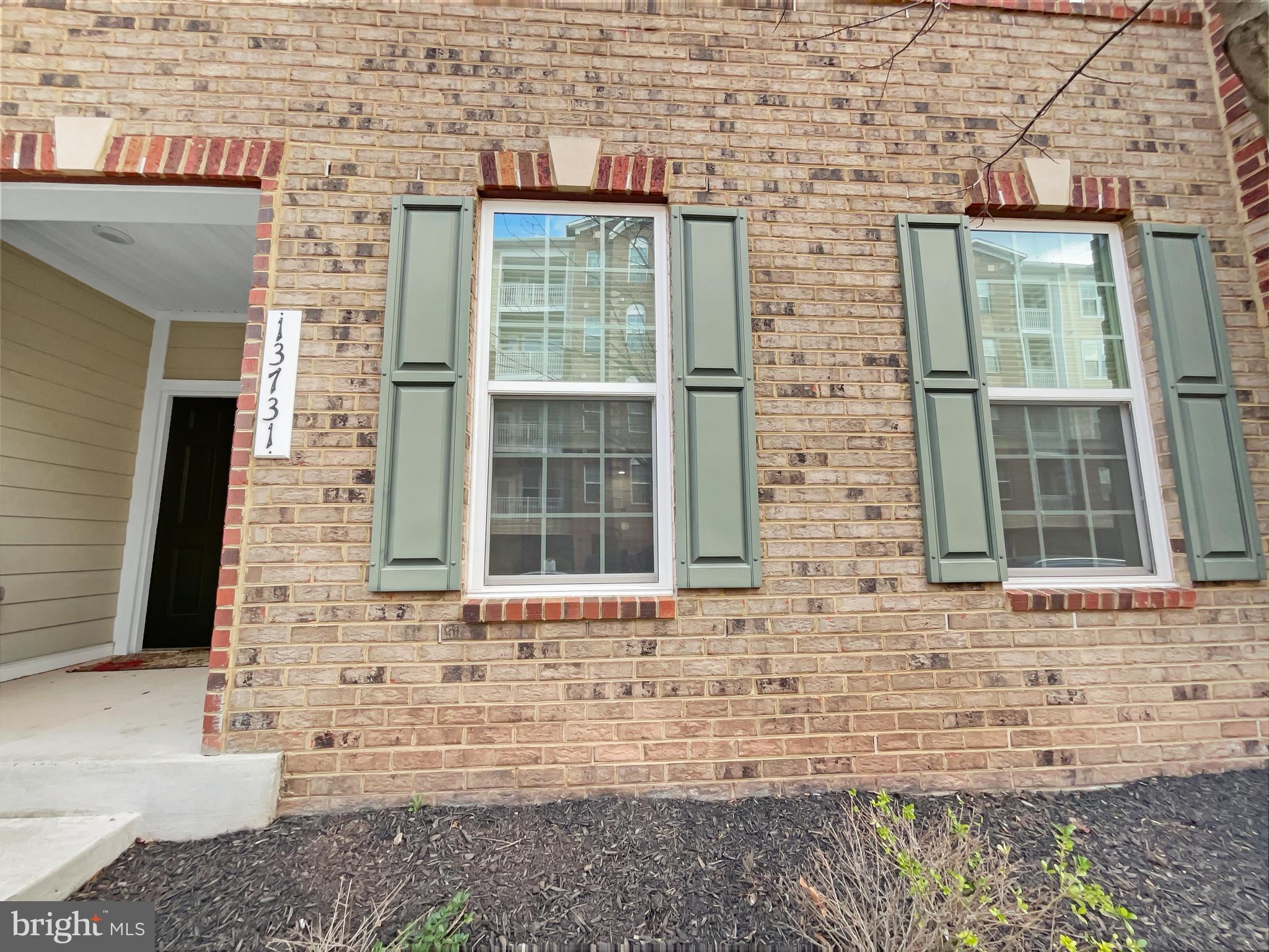 13731 Endeavour Drive Herndon, VA 20171 - Photo 13 of 37 a front view of a brick house