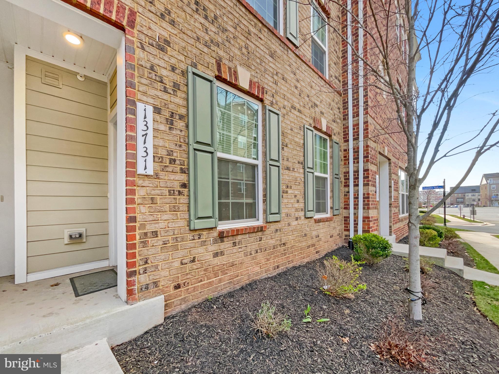 13731 Endeavour Drive Herndon, VA 20171 - Photo 15 of 37 a view of a brick house with a large windows