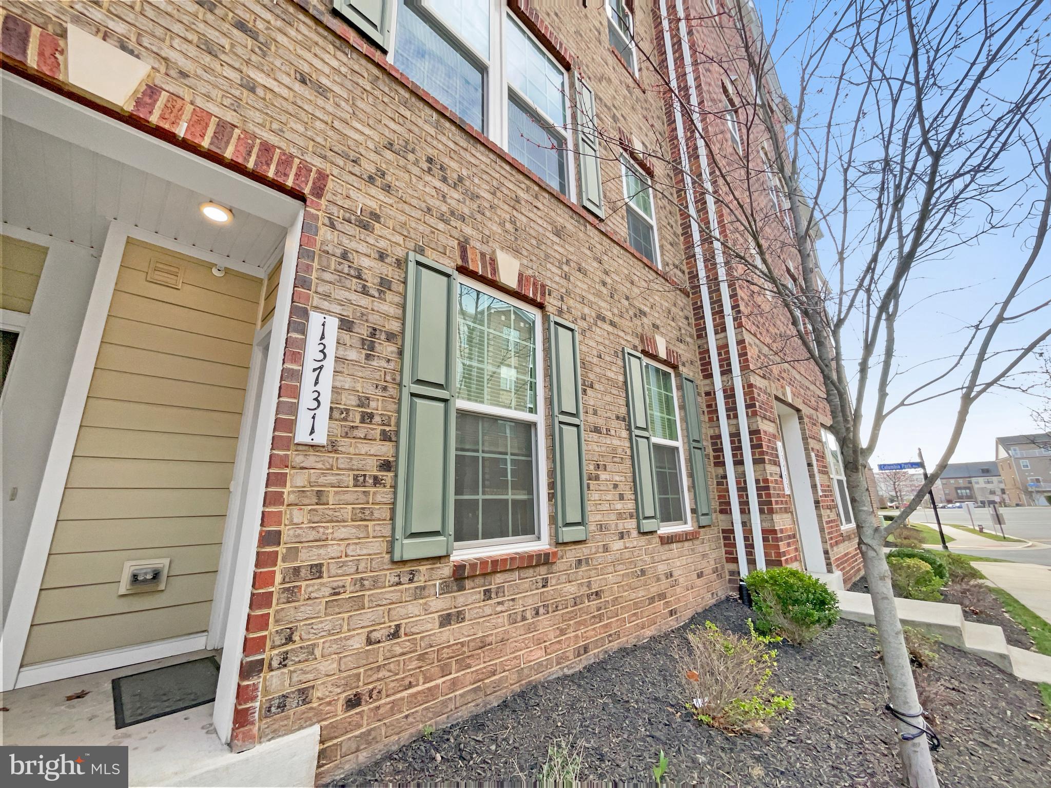 13731 Endeavour Drive Herndon, VA 20171 - Photo 16 of 37 a view of a brick house with a large windows
