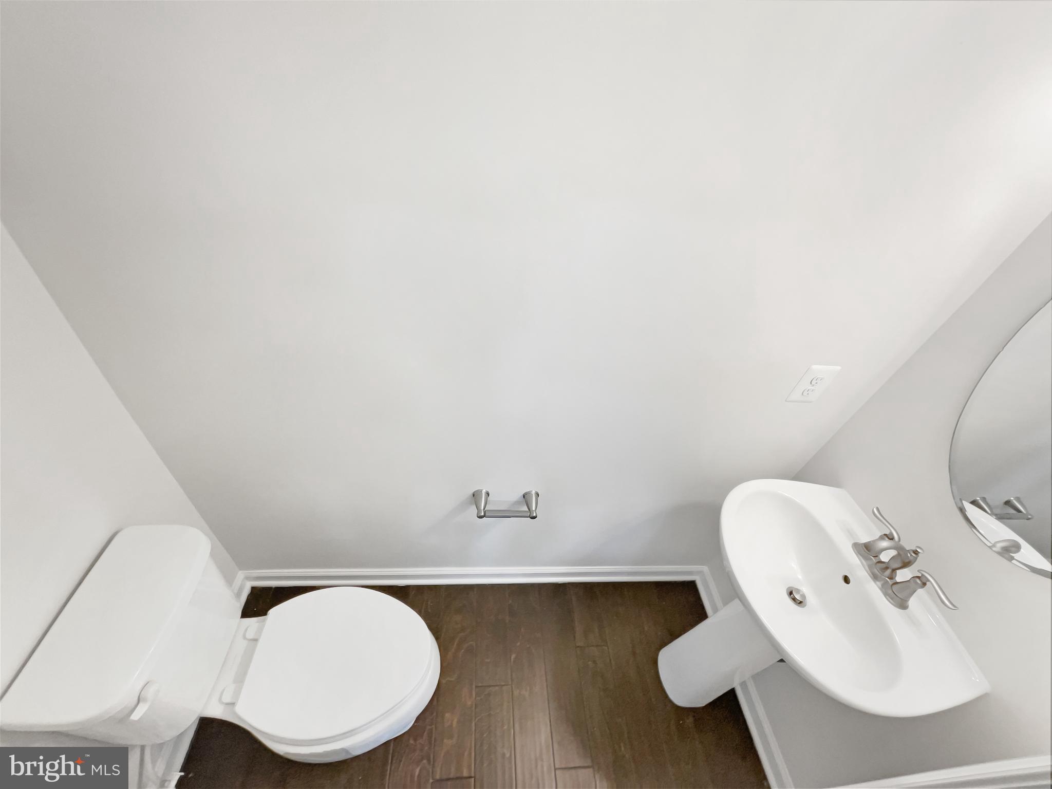 13731 Endeavour Drive Herndon, VA 20171 - Photo 17 of 37 a bathroom with a toilet mirror and sink