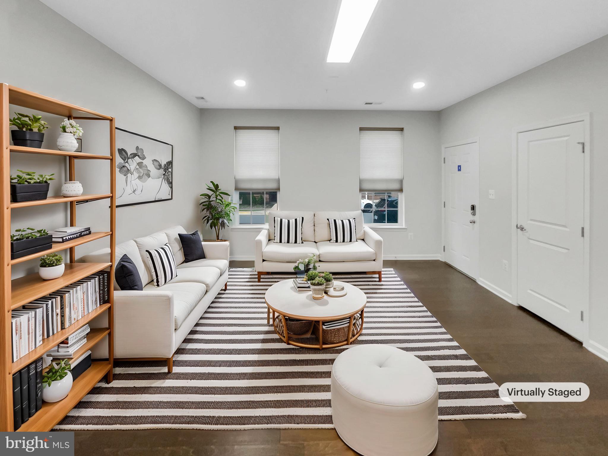 13731 Endeavour Drive Herndon, VA 20171 - Photo 2 of 37 a living room with furniture and a book shelf