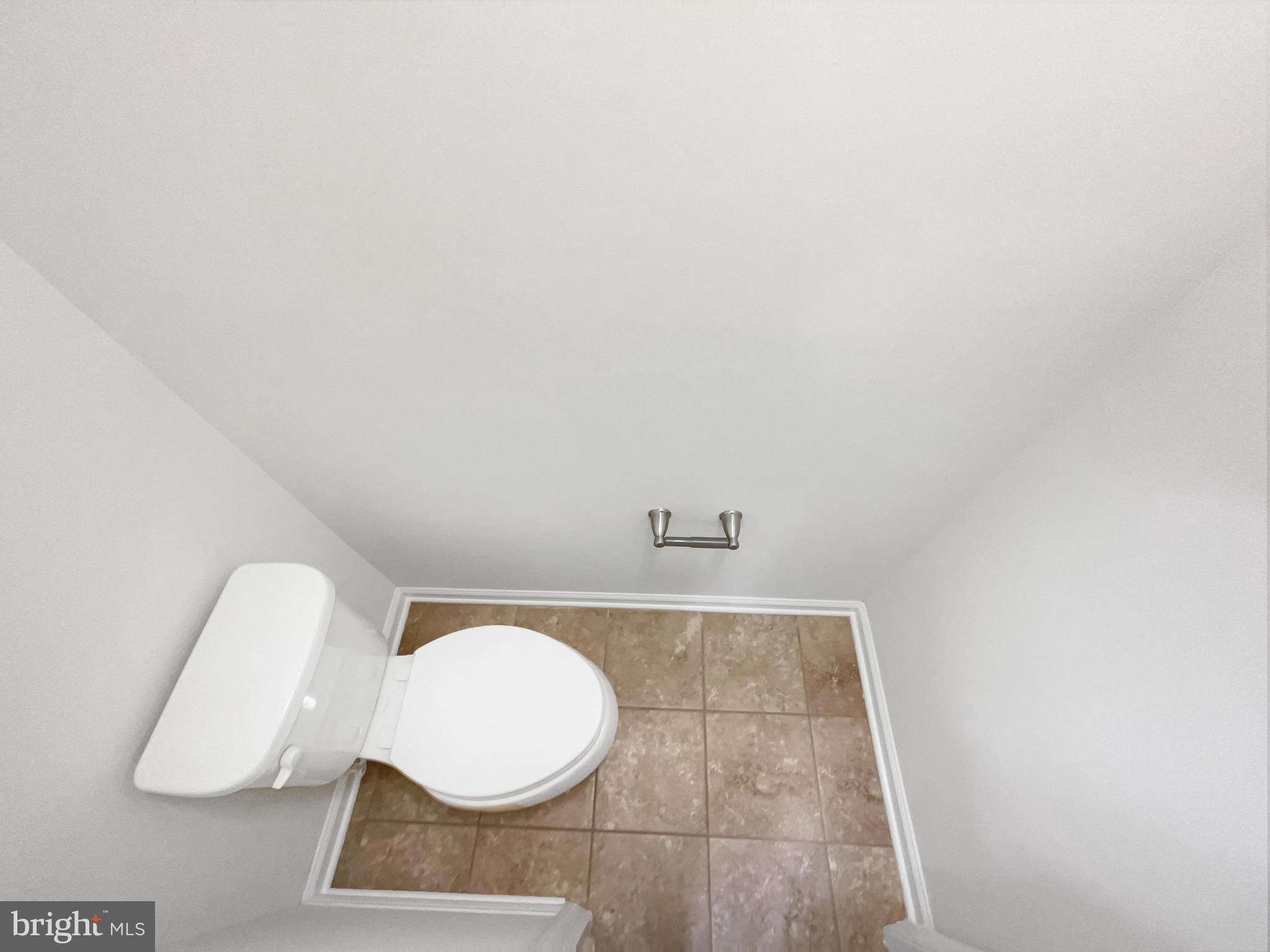 13731 Endeavour Drive Herndon, VA 20171 - Photo 26 of 37 a bathroom with a toilet and a mirror