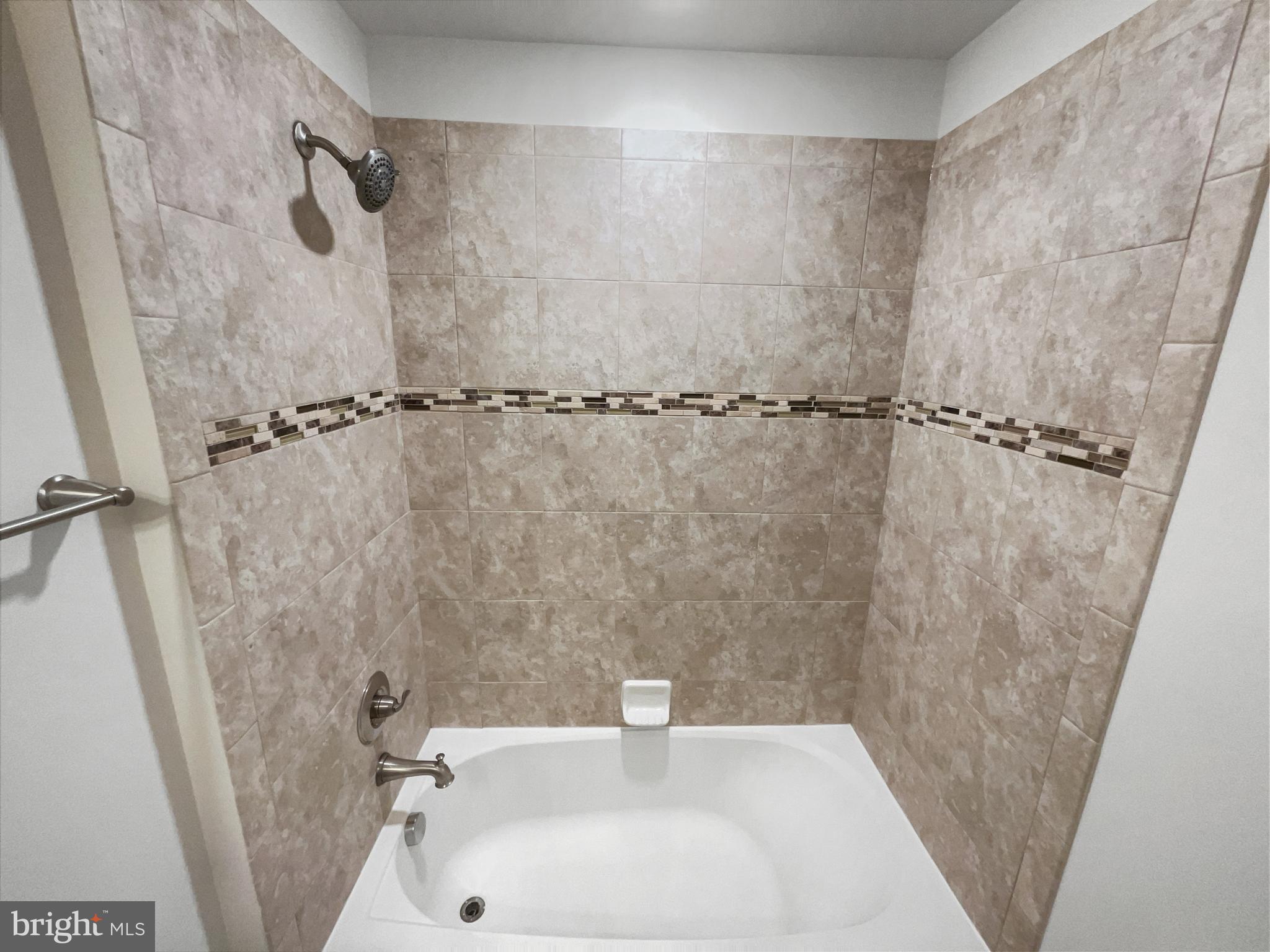 13731 Endeavour Drive Herndon, VA 20171 - Photo 28 of 37 a bathroom with a sink a window and a shower
