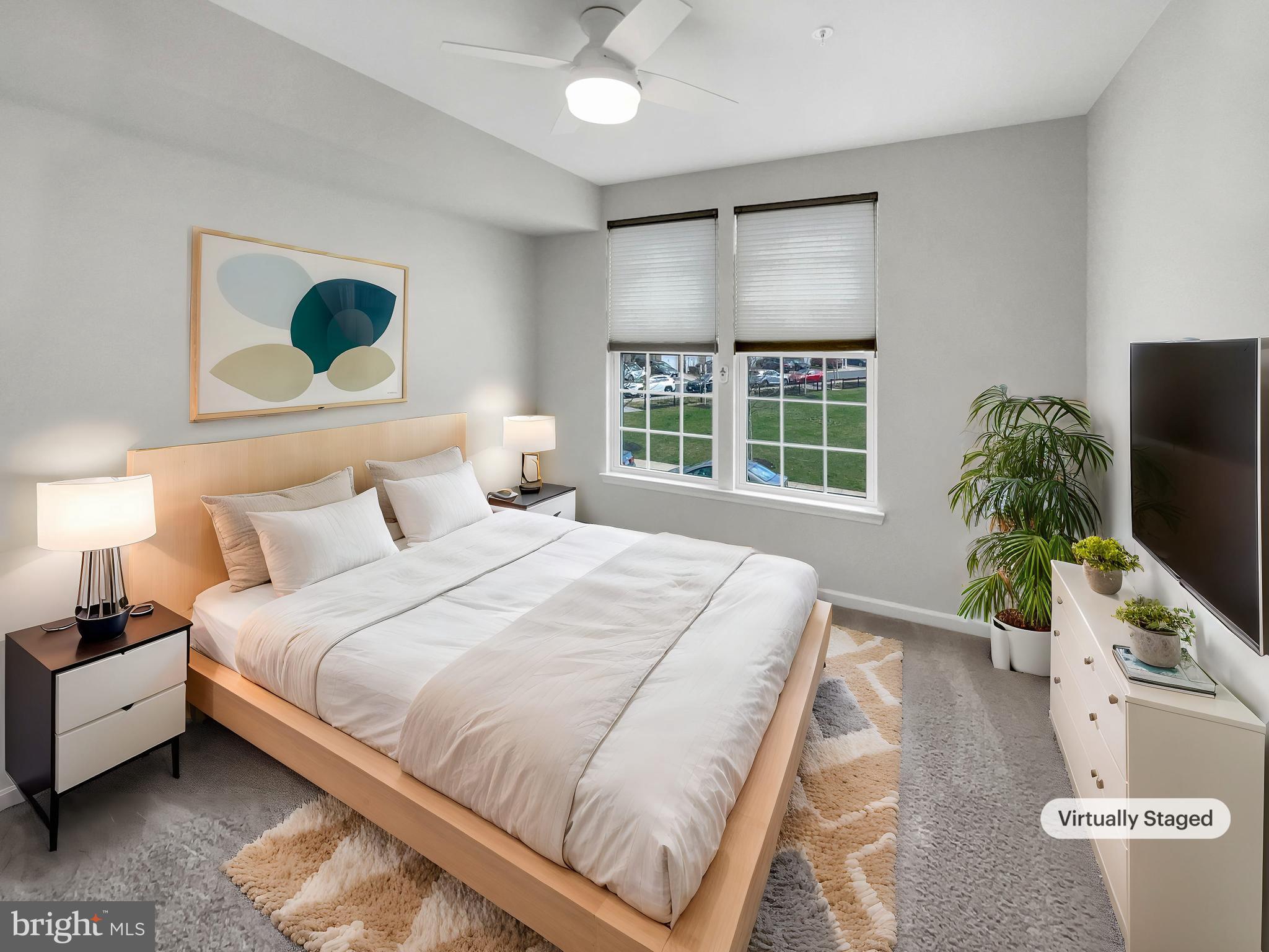 13731 Endeavour Drive Herndon, VA 20171 - Photo 4 of 37 a bedroom with a bed and potted plant