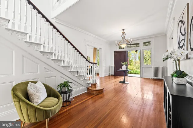 a view of a livingroom with furniture window and wooden floor
