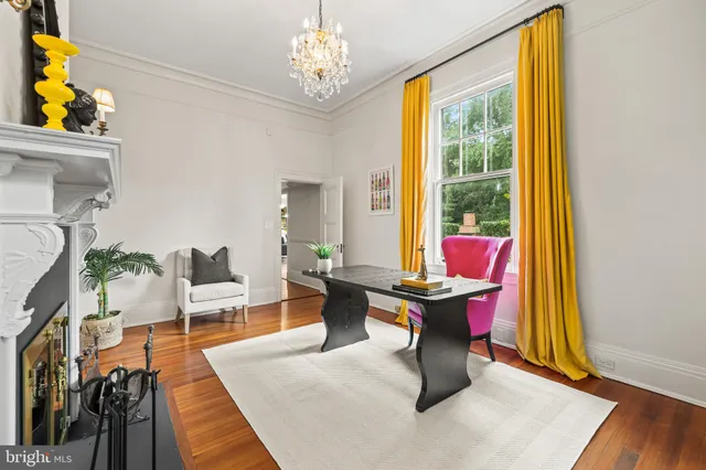 a kitchen with stainless steel appliances granite countertop a stove a sink and a wooden floors