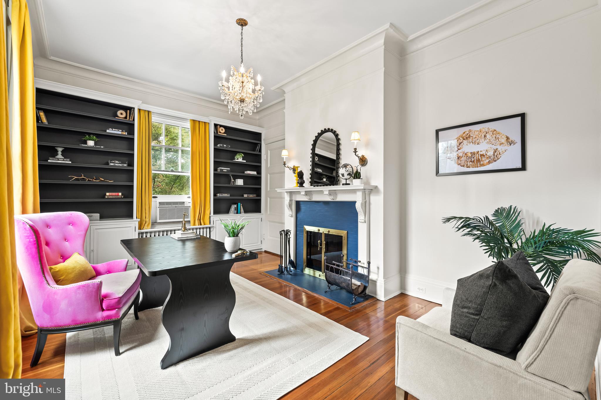 1926 Ruxton Road Ruxton, MD 21204 - Photo 19 of 108 a living room with furniture a chandelier and a fireplace