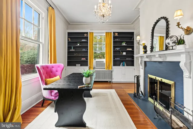 a kitchen with stainless steel appliances granite countertop a sink cabinets and wooden floor