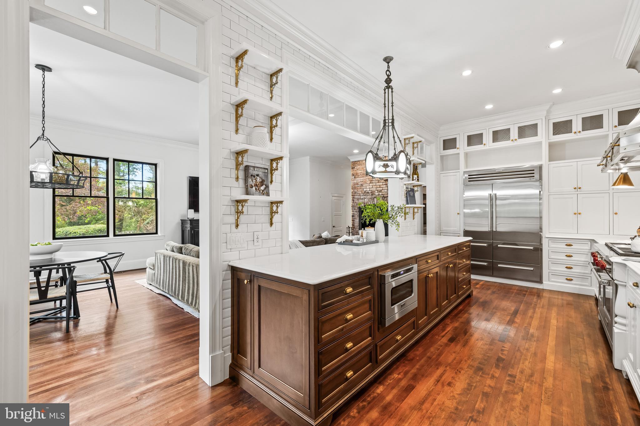 1926 Ruxton Road Ruxton, MD 21204 - Photo 29 of 106 a kitchen with stainless steel appliances granite countertop a lot of counter space and wooden floors