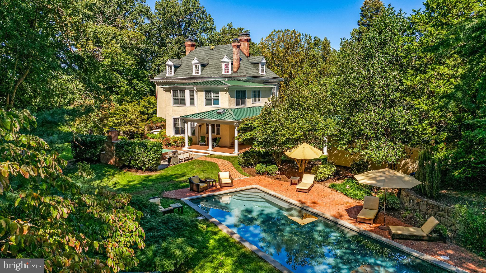 1926 Ruxton Road Ruxton, MD 21204 - Photo 3 of 108 a aerial view of a house with table and chairs and a fire pit