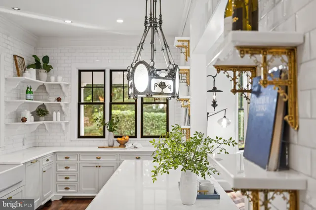 a view of an empty room with a ceiling fan