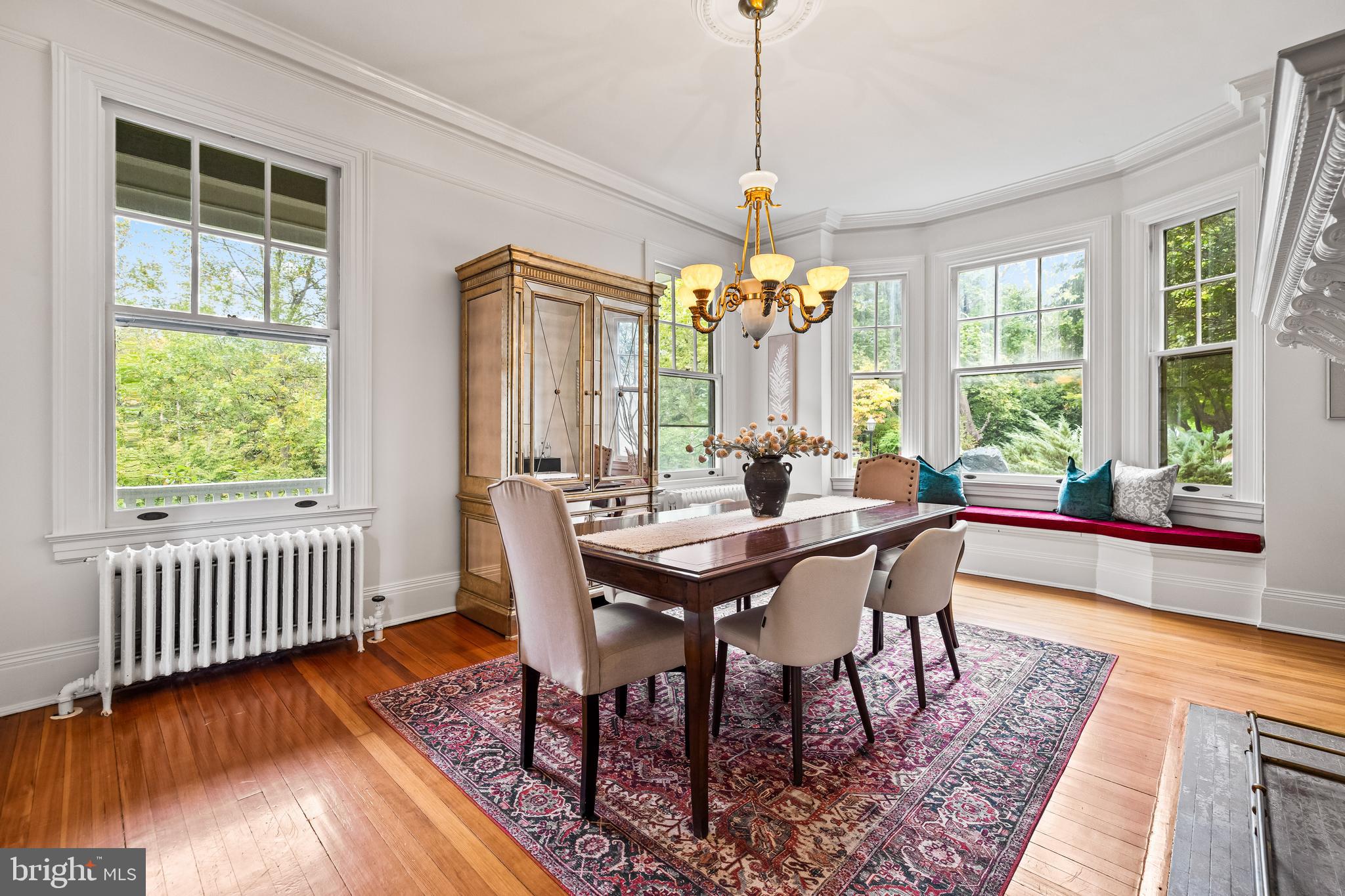 1926 Ruxton Road Ruxton, MD 21204 - Photo 41 of 108 a view of a dining room with furniture window and wooden floor