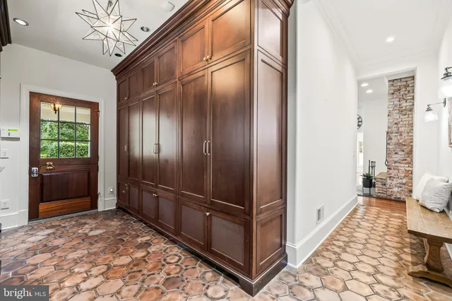a view of a street with a house in the background