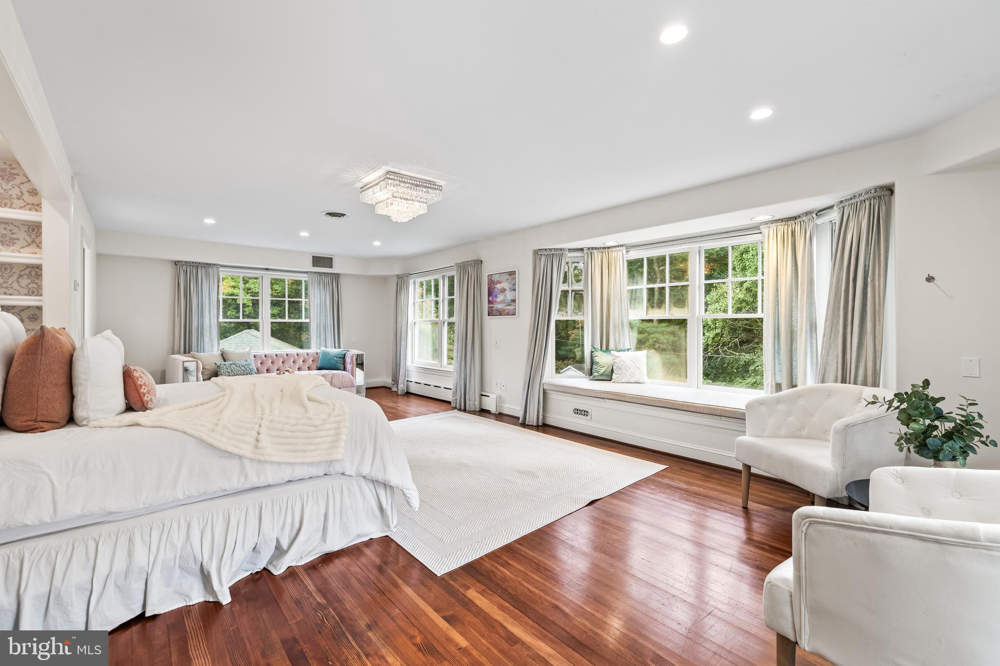 1926 Ruxton Road Ruxton, MD 21204 - Photo 55 of 108 a spacious bedroom with a large bed and a large window