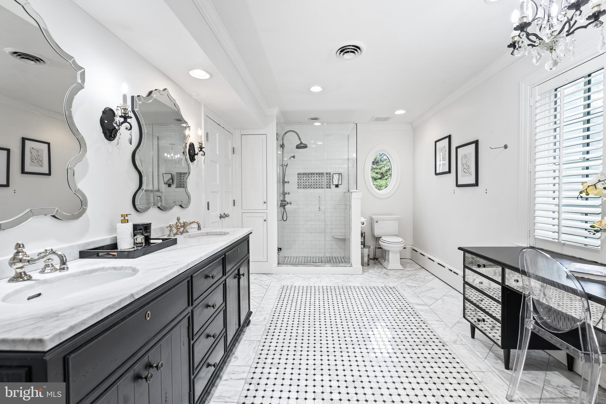 1926 Ruxton Road Ruxton, MD 21204 - Photo 60 of 108 a spacious bathroom with a double vanity sink a mirror and a shower