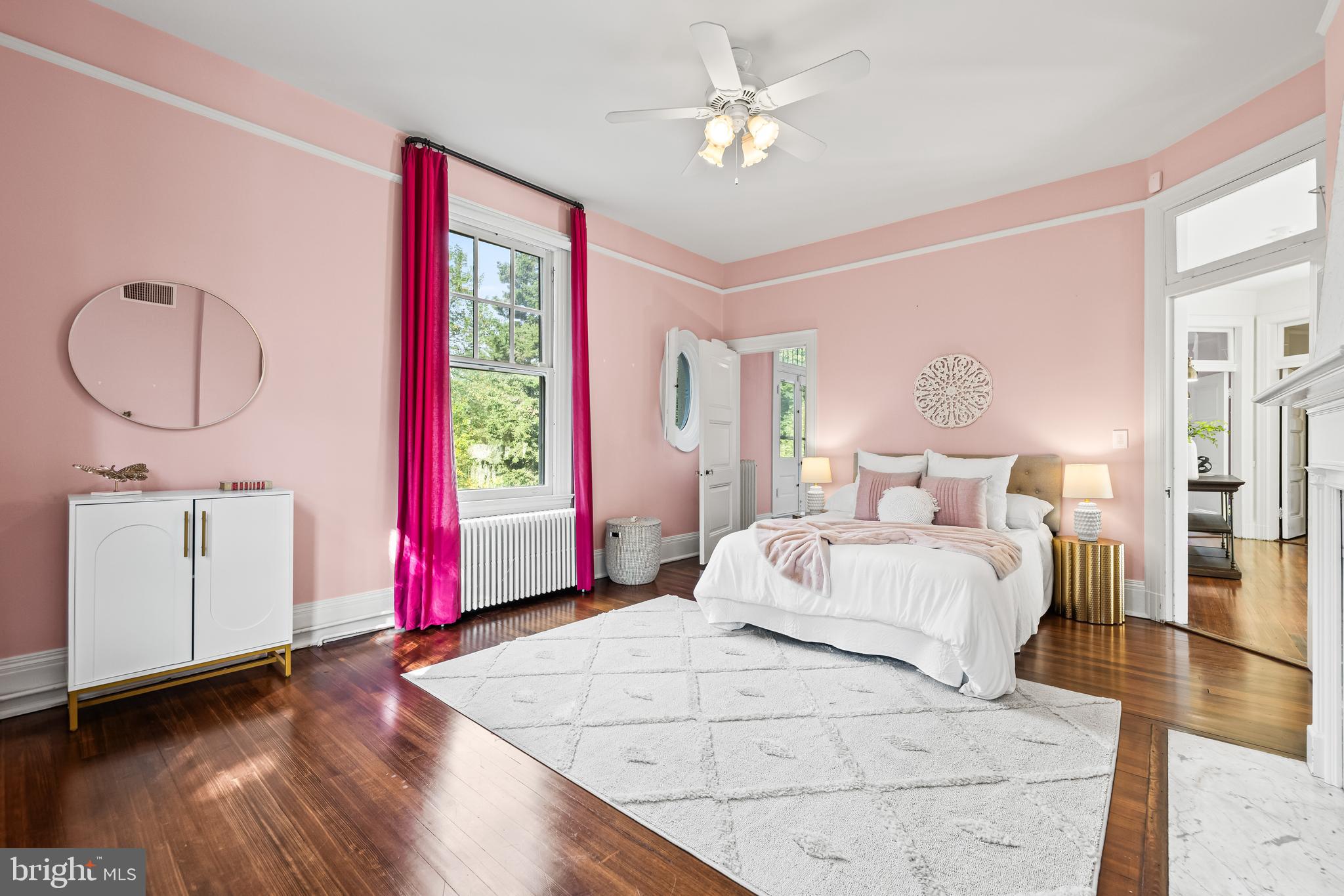 1926 Ruxton Road Ruxton, MD 21204 - Photo 65 of 108 a bedroom with a bed a chandelier and a window