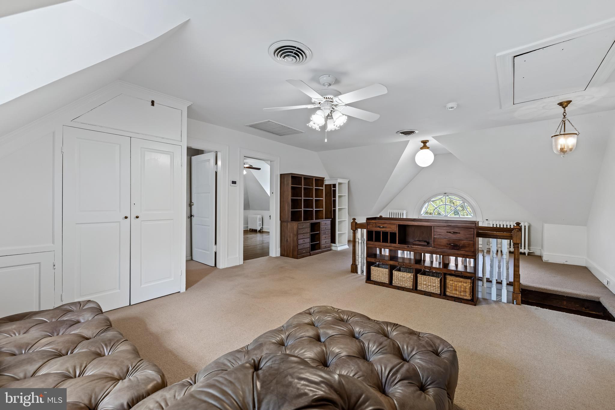 1926 Ruxton Road Ruxton, MD 21204 - Photo 73 of 106 a spacious bedroom with a bed a chandelier and a dresser